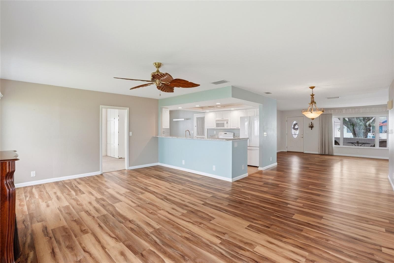 Open kitchen, living room, dining room and family room. - 3939 90TH TER N, PINELLAS PARK