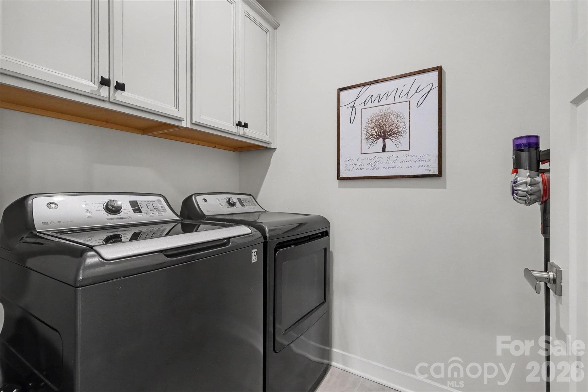 Laundry room with cabinets - 6513 Cumberland Drive, Harrisburg