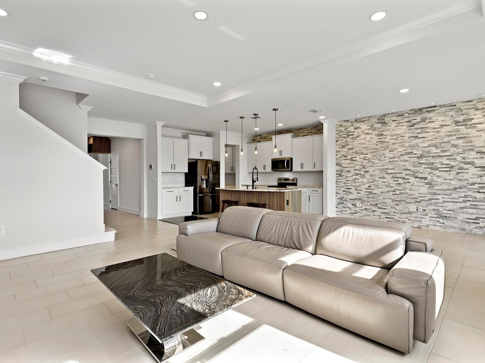 great room flows from the kitchen and dining room - 5211 TANNIN LN, BRADENTON