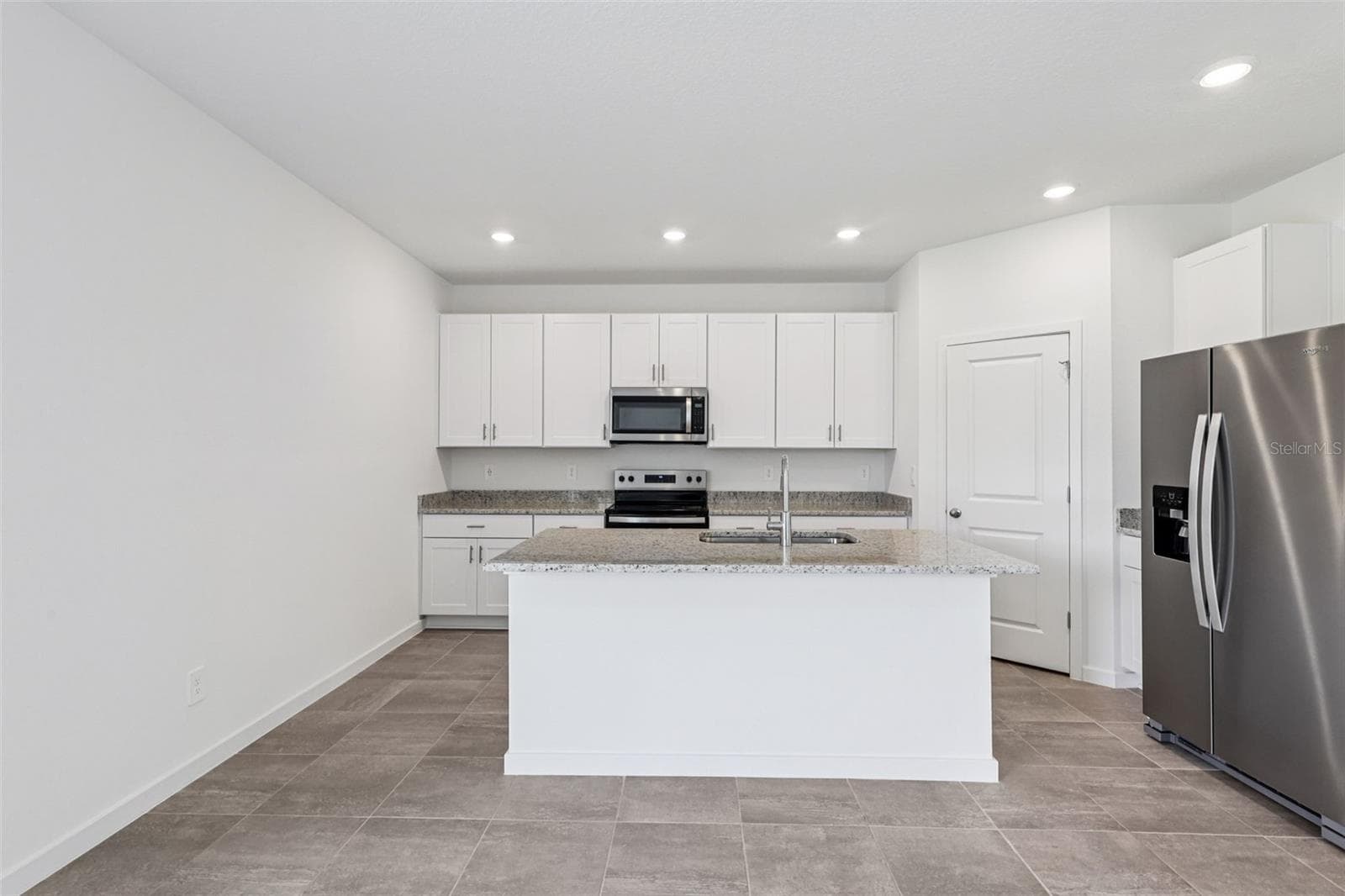 The interior photos are of another home with the same floor plan but different interior color package finishes. Some details may vary - 89 WANDERING CREEK WAY, PALM COAST