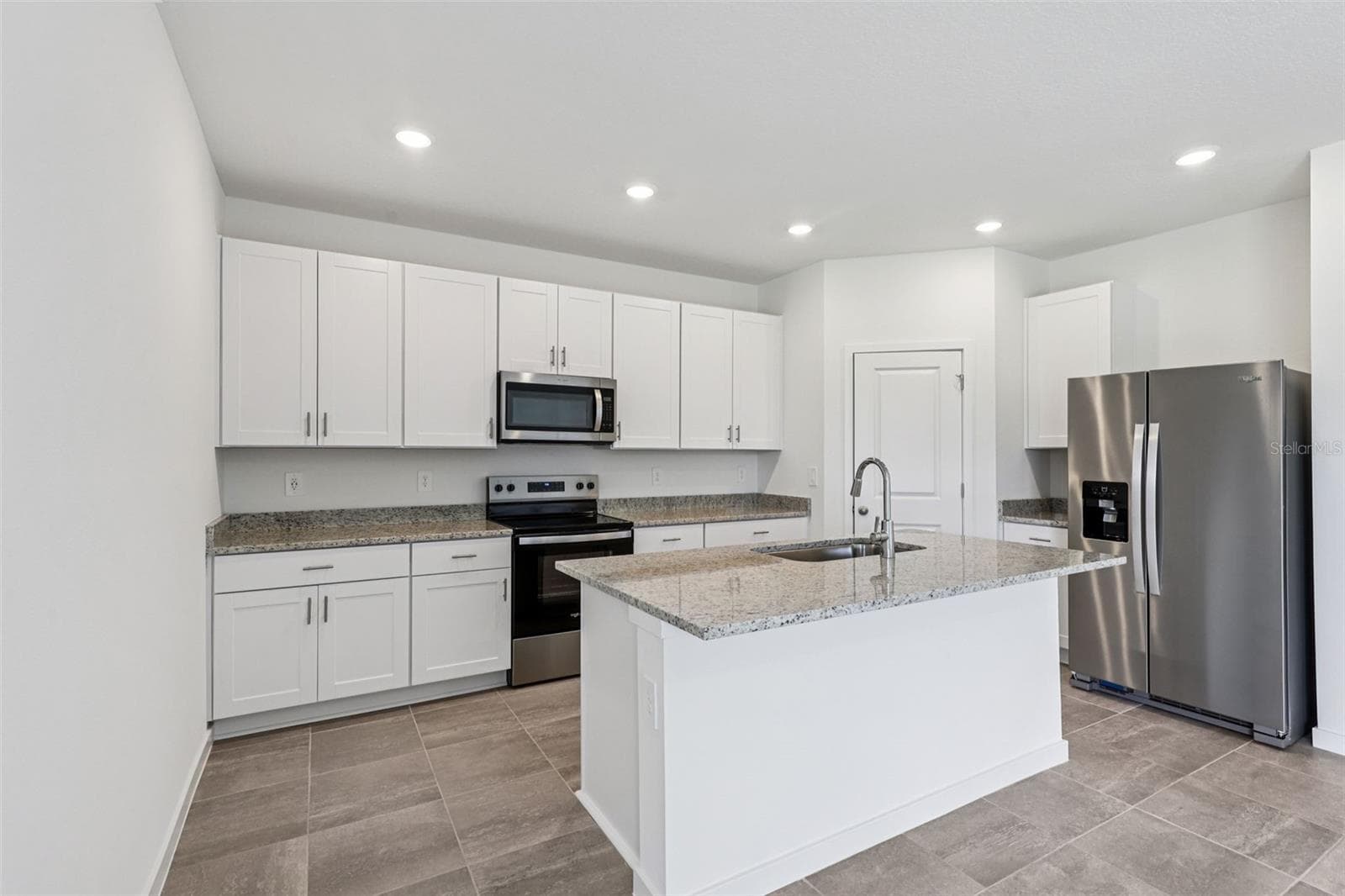 The interior photos are of another home with the same floor plan but different interior color package finishes. Some details may vary - 89 WANDERING CREEK WAY, PALM COAST
