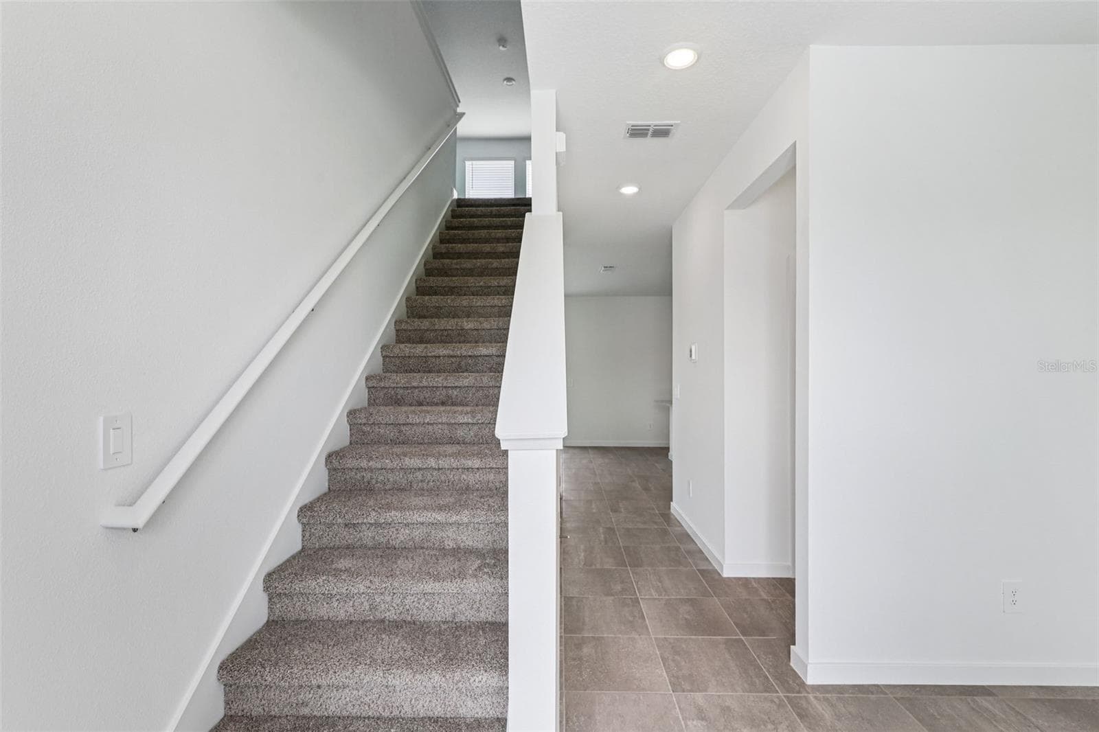 The interior photos are of another home with the same floor plan but different interior color package finishes. Some details may vary - 89 WANDERING CREEK WAY, PALM COAST