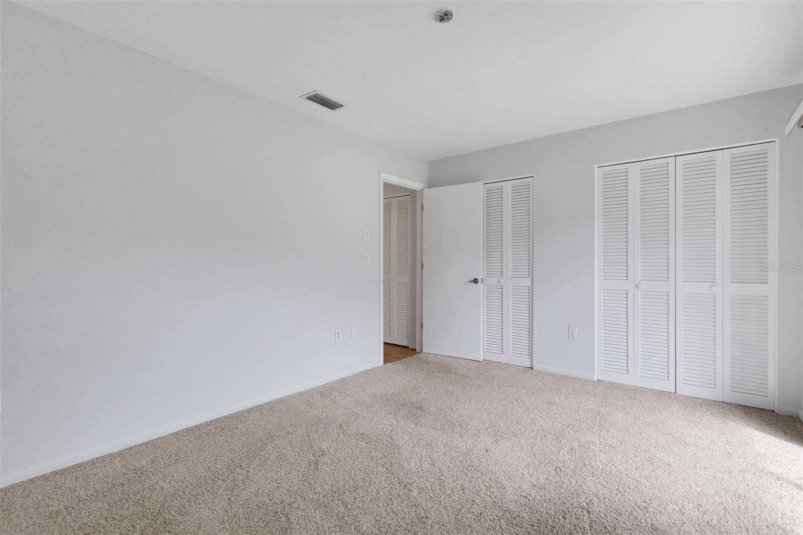 Second Bedroom - Wall of Built-in Closets - 4465 ATWOOD CAY CIR #12, SARASOTA