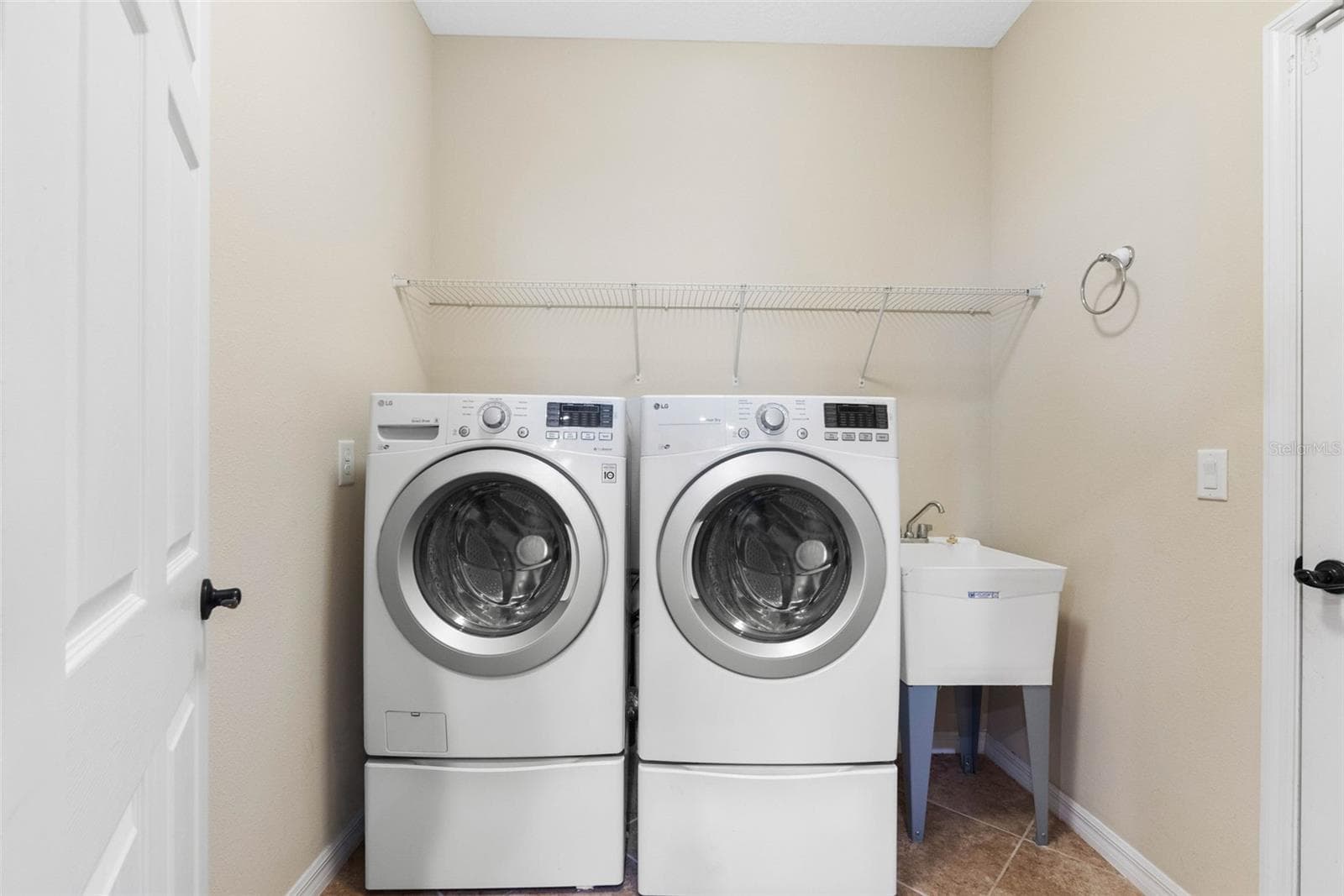 Laundry room located off of the kitchen - 7949 TASSO CT, SEMINOLE