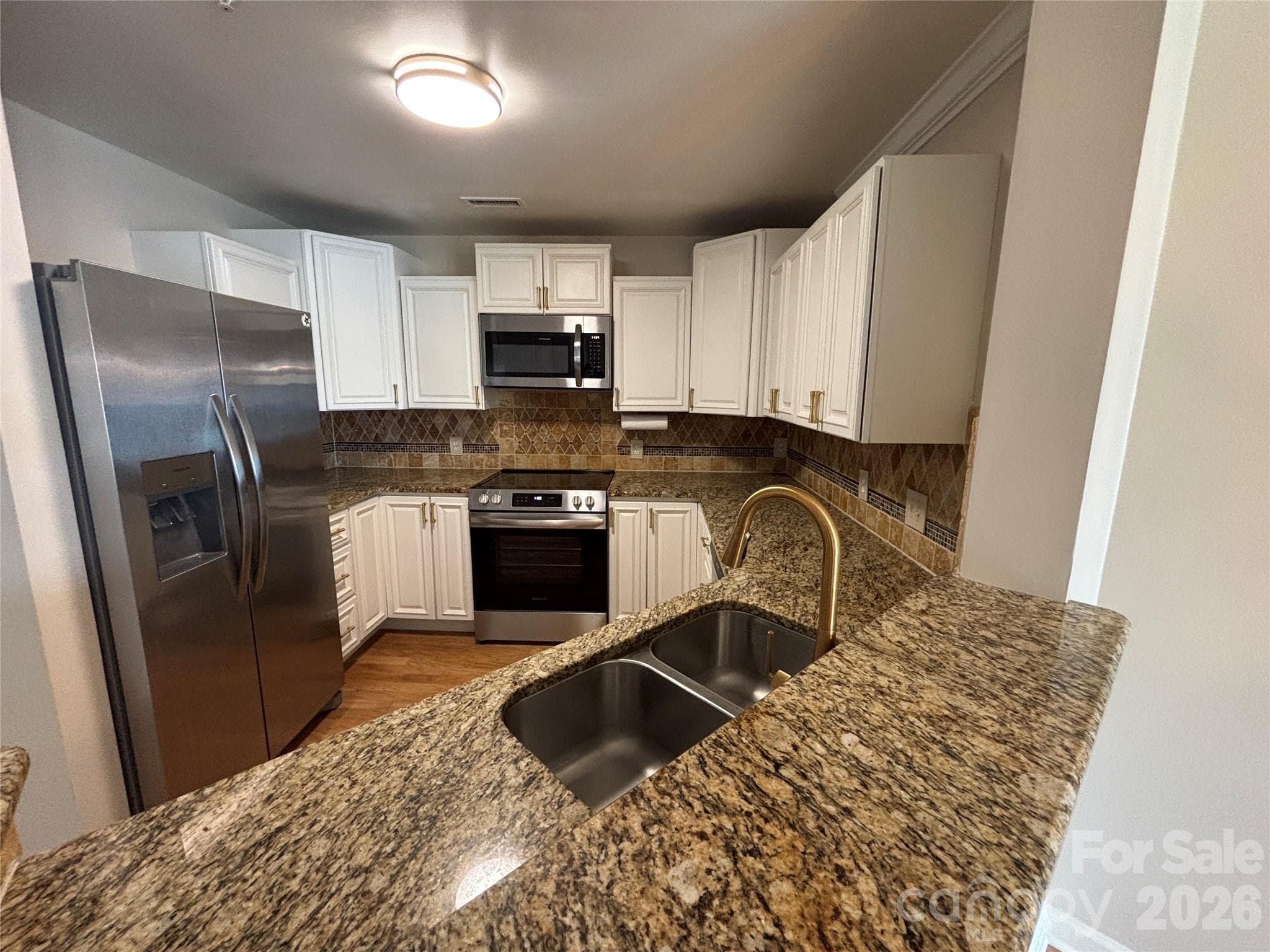 Kitchen with a new suite of Frigidaire appliances - 1332 Torrence Circle, Davidson