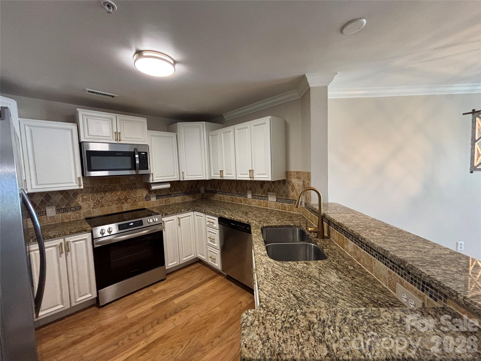Kitchen with a new suite of Frigidaire appliances - 1332 Torrence Circle, Davidson
