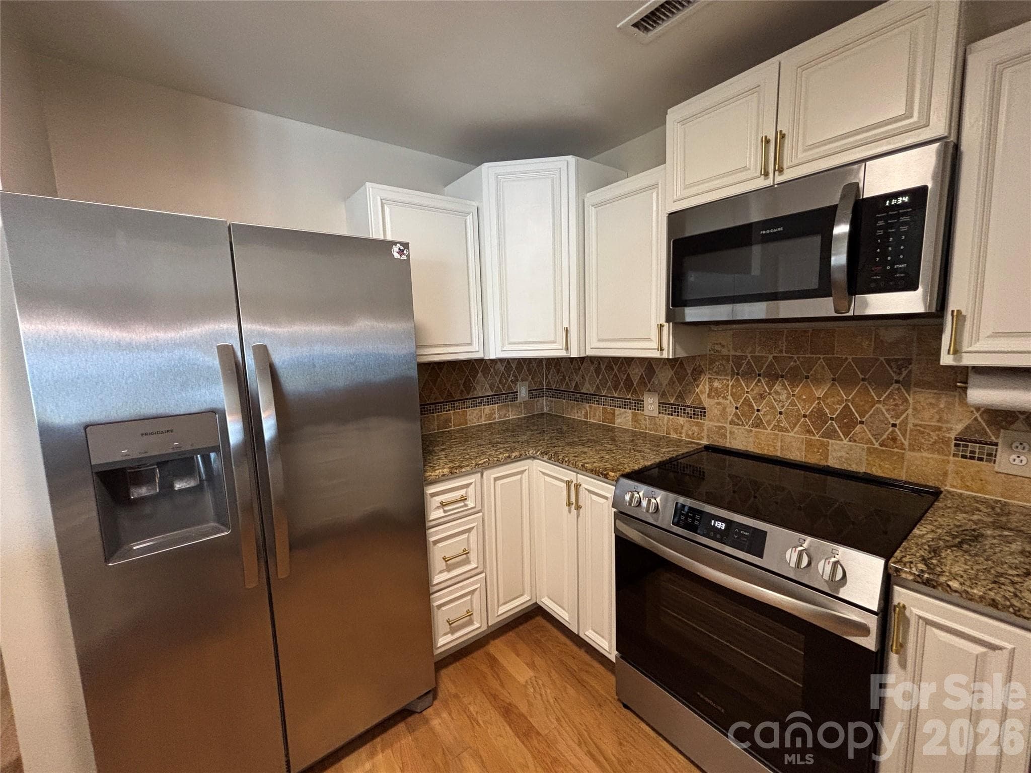 Kitchen with a new suite of Frigidaire appliances - 1332 Torrence Circle, Davidson
