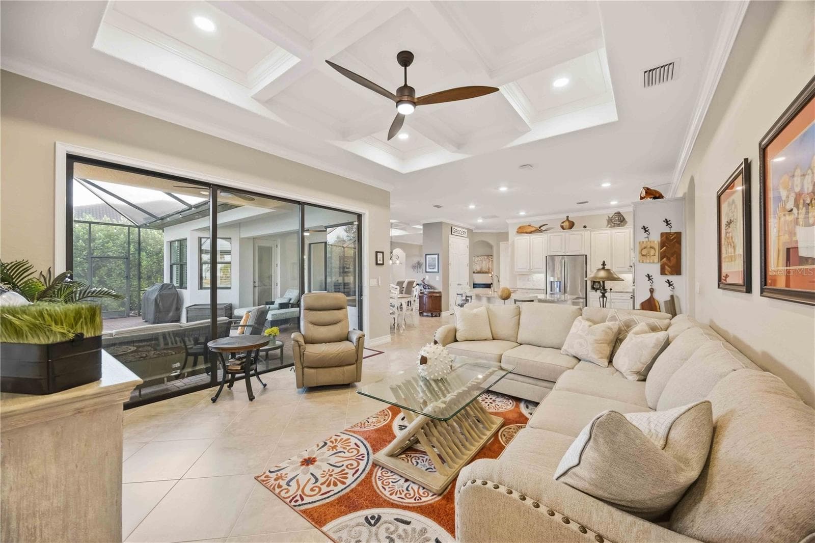 The sliding doors open to the great room and bring abundant light. - 10720 TARFLOWER DR, VENICE
