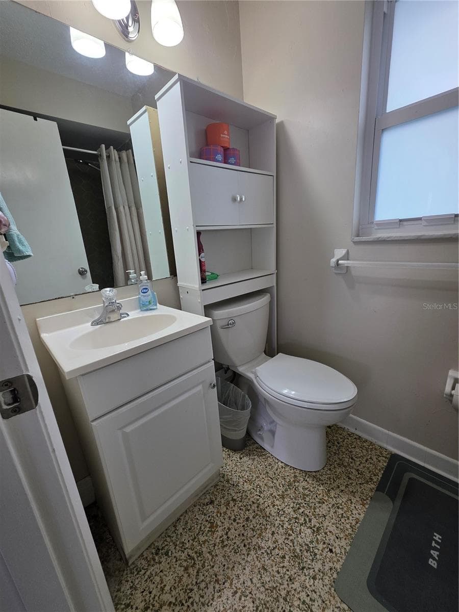sink, overhead storage and full shower in this room - 1535 URBANA AVENUE, DELTONA