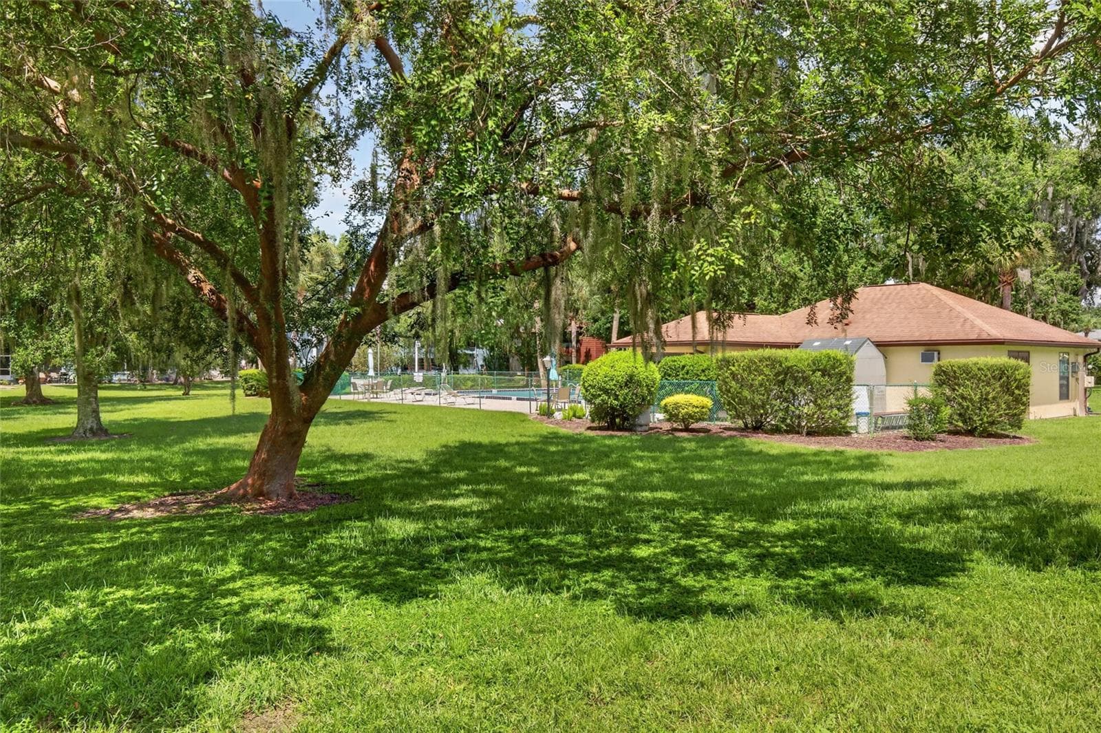 View of pool from the back patio - 508 BAHIA CIR #A, OCALA