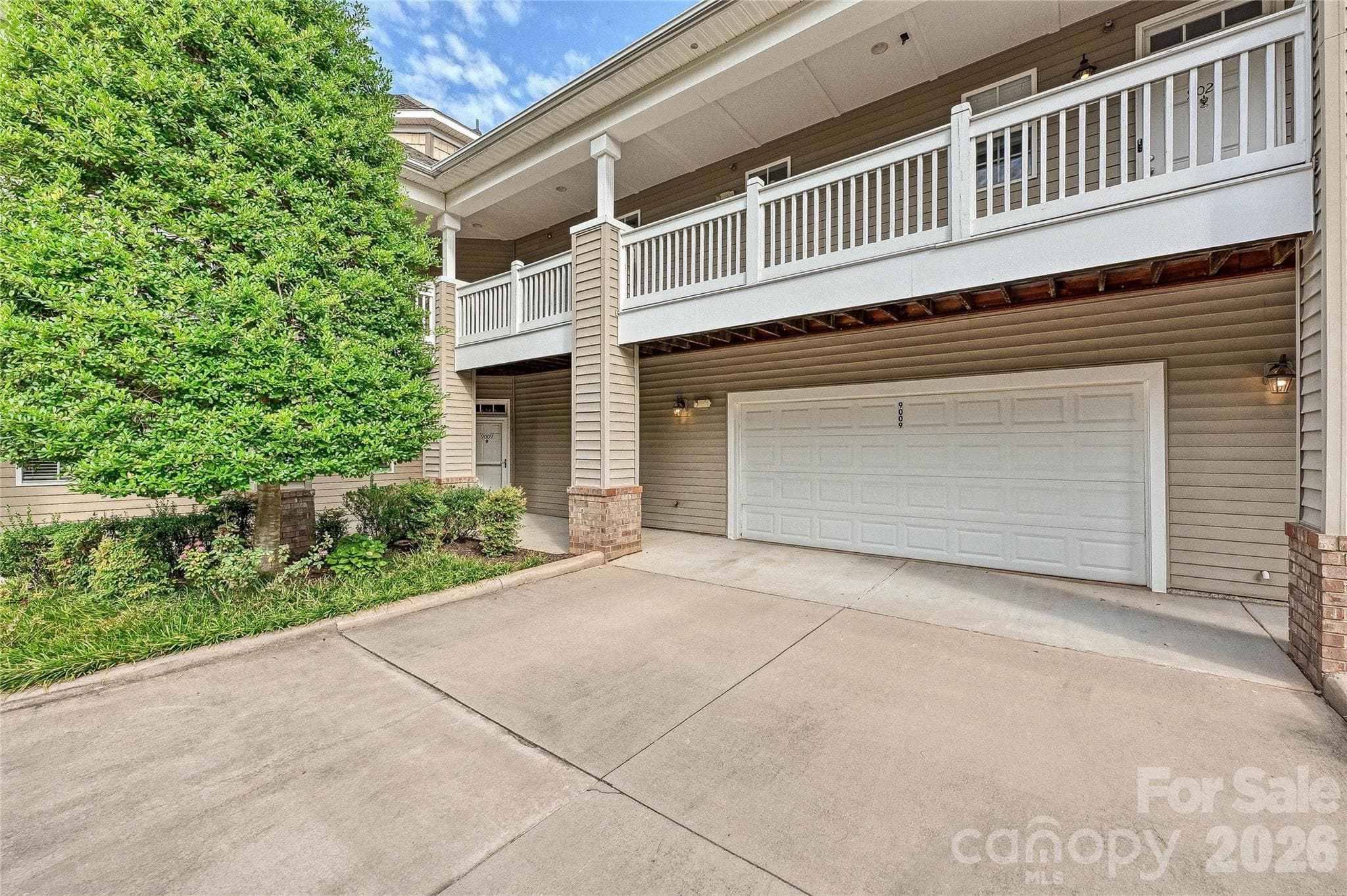 Ground-level end-unit condo in Cornelius’ Edinburgh Square community features an attached two-car garage and convenient one-level living. - 9009 Rosalyn Glen Road, Cornelius
