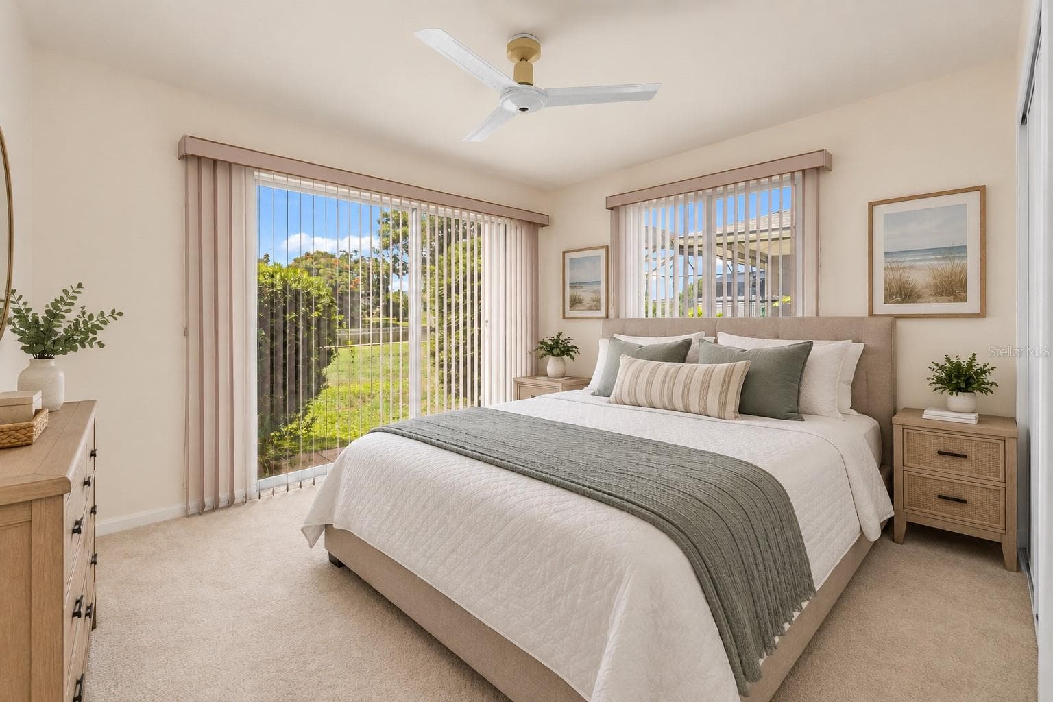 Bedroom 3 staged as a bedroom with a waterfront view. - 160 ANNAPOLIS LN, ROTONDA WEST