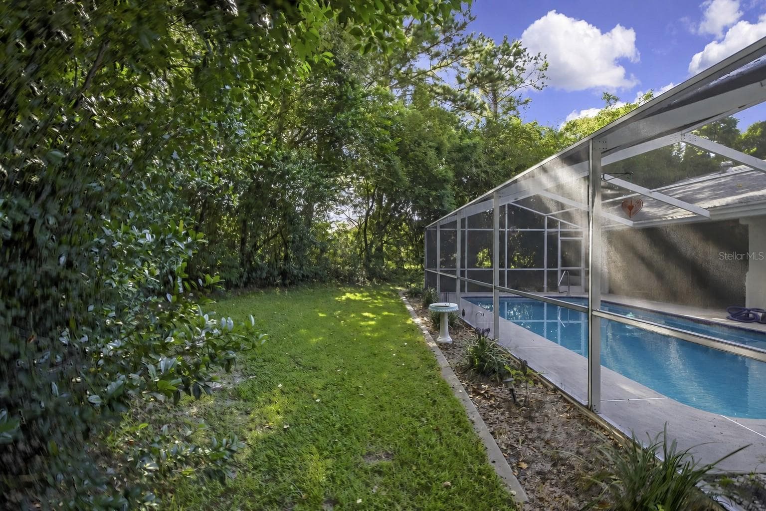 Exterior view of the screened pool enclosure - 1097 FLORIAN WAY, SPRING HILL