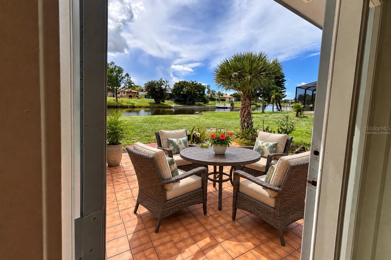 Virtually staged with patio furniture. - 160 ANNAPOLIS LN, ROTONDA WEST