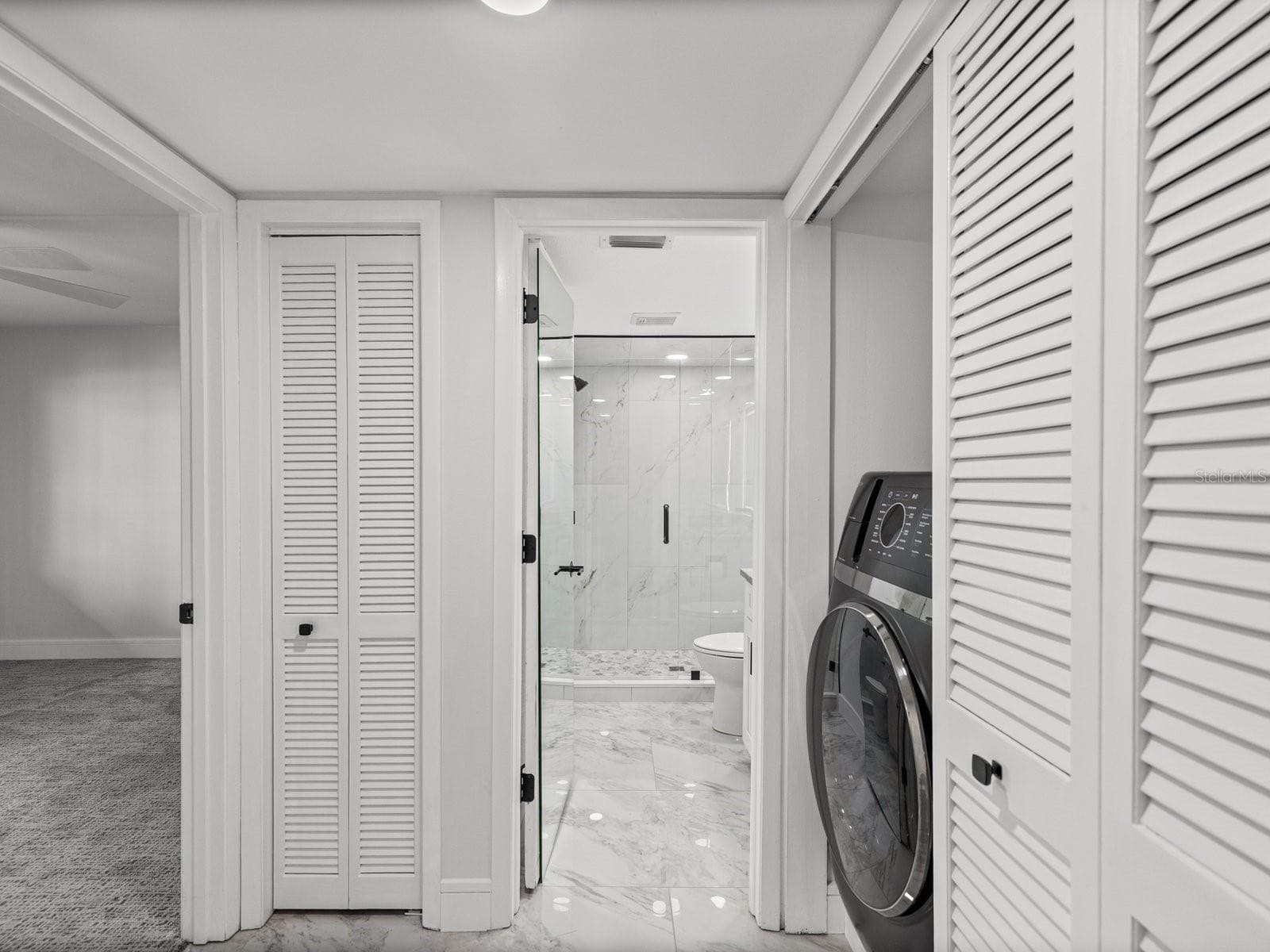 NEW modern washer/dryer combo and hall has pocket door for privacy of visiting guests - 3076 EASTLAND BLVD #203, CLEARWATER