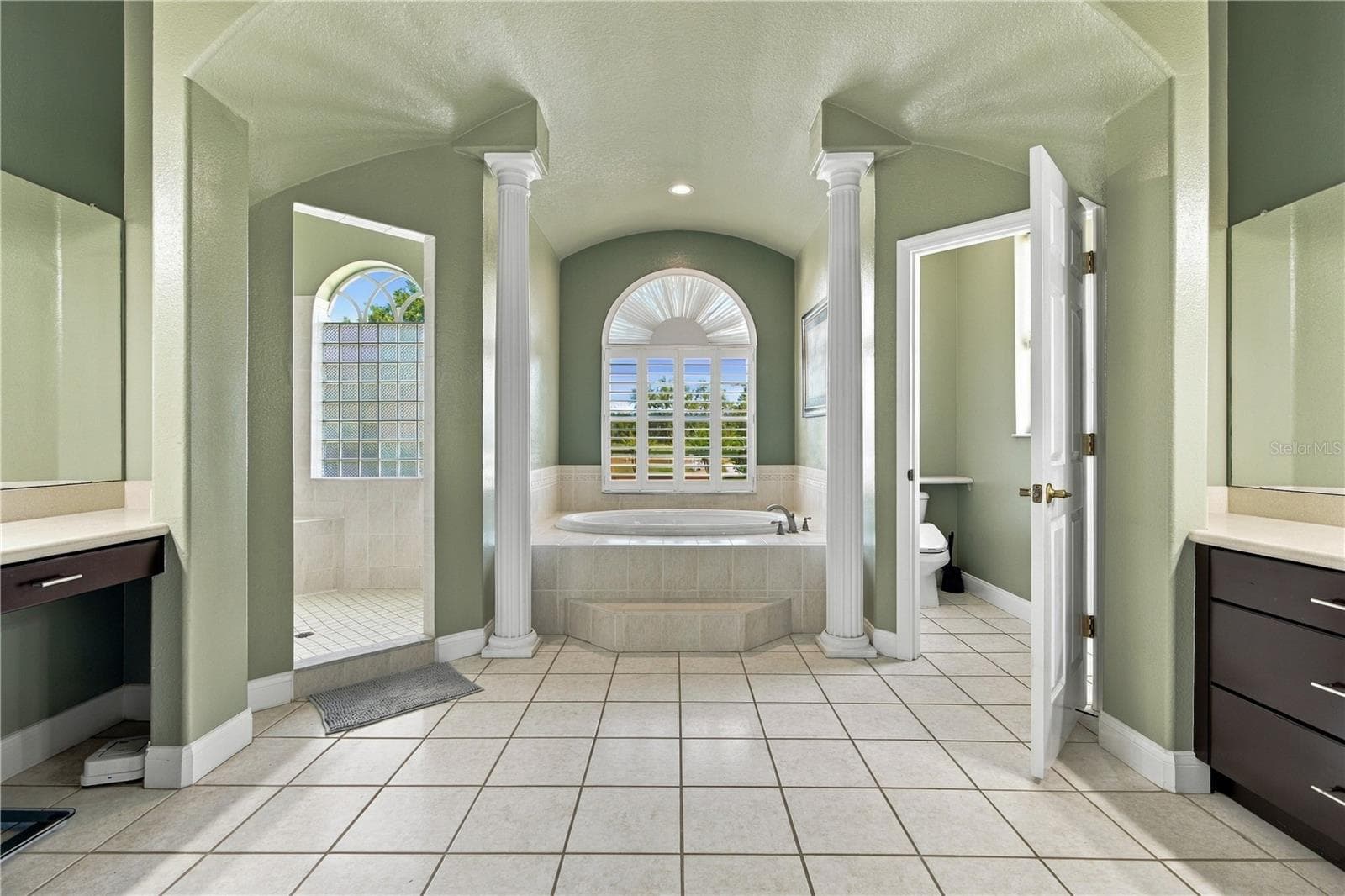Luxurious Primary bath creates a spacious, replaxing retreat - 6722 W SENTINEL BLUFF PATH, BEVERLY HILLS