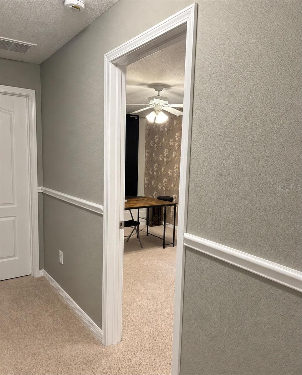 Hallway to bedroom 2 - 9412 TRUMPET VINE LOOP, TRINITY