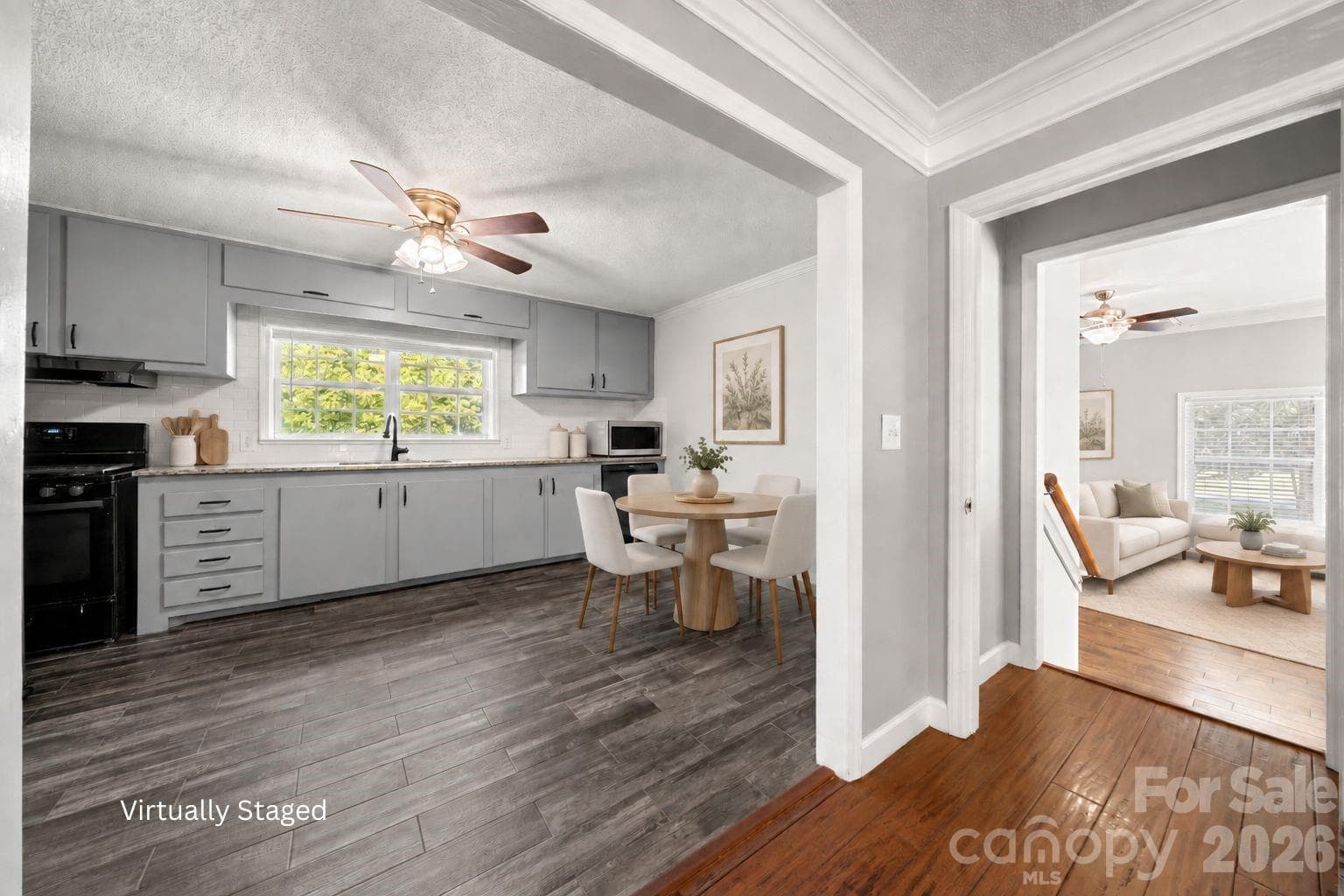 Virtually staged - Staged to show layout from kitchen to additional living room space. Both fridges in kitchen to convey. - 109 Woodside Avenue, Gastonia