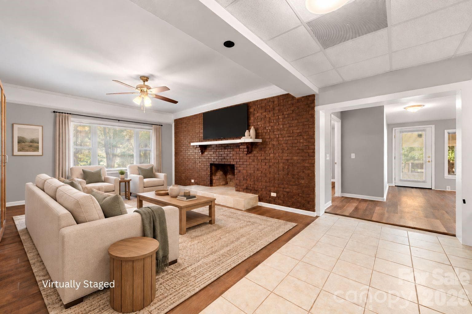 Virtually staged - Downstairs den area with wood burning fireplace. Adjacent to dining area and 2nd living quarters full kitchen. - 109 Woodside Avenue, Gastonia