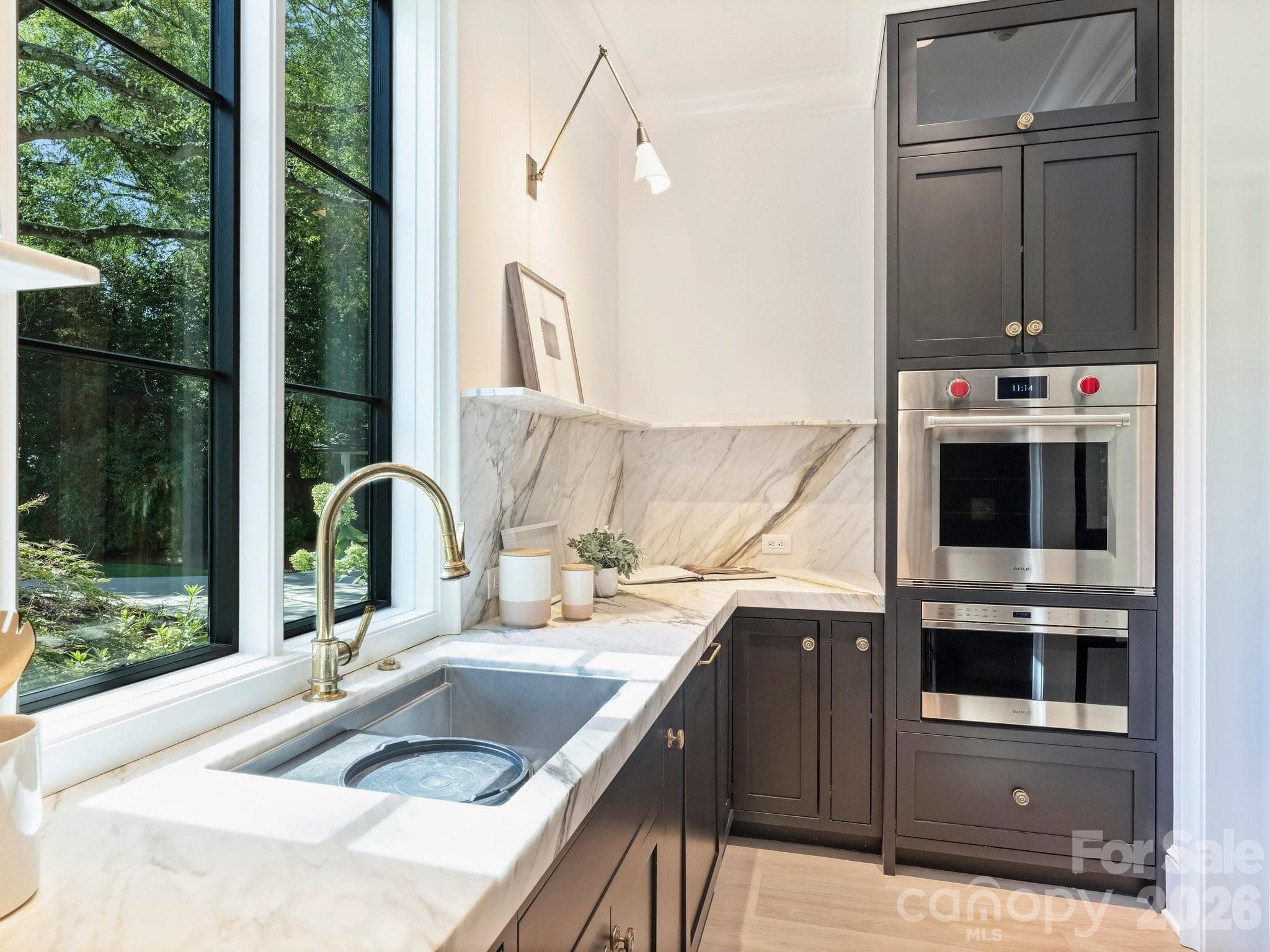 Microwave and wall oven with a second dishwasher and sink with Waterworks fixture - 600 Hermitage Road, Charlotte