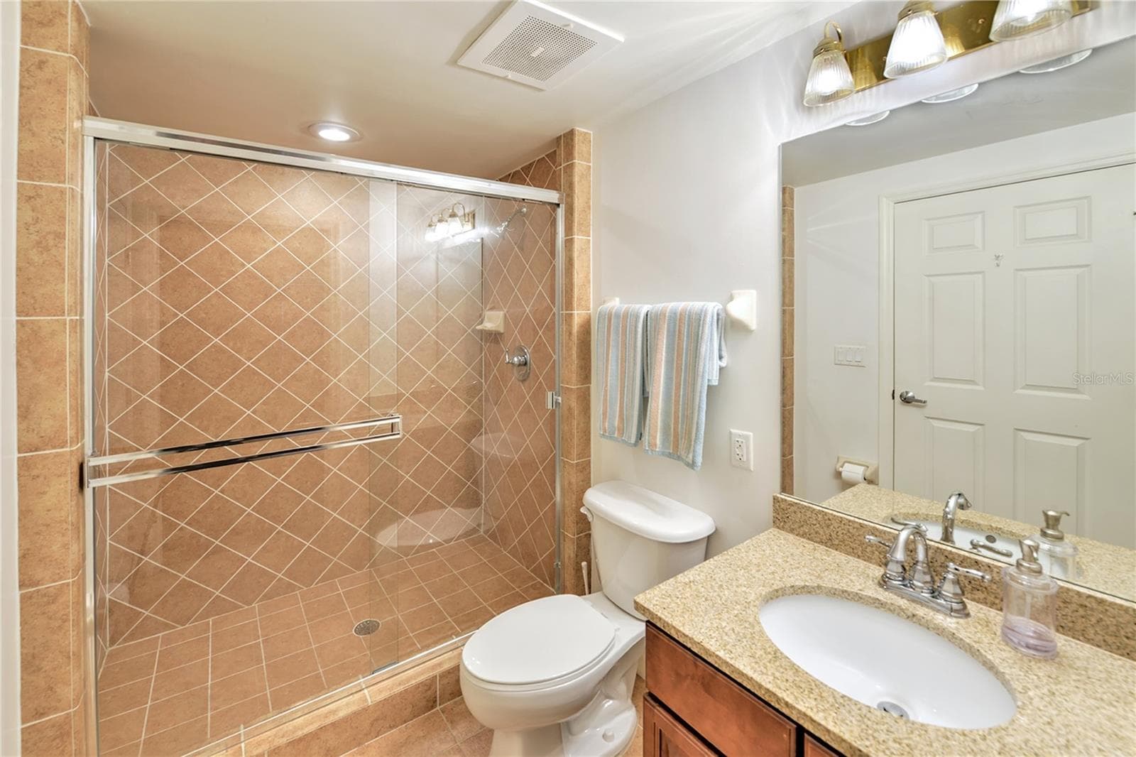 Ensuite private bath with walk-in shower. - 1900 N ATLANTIC AVE #1603, DAYTONA BEACH