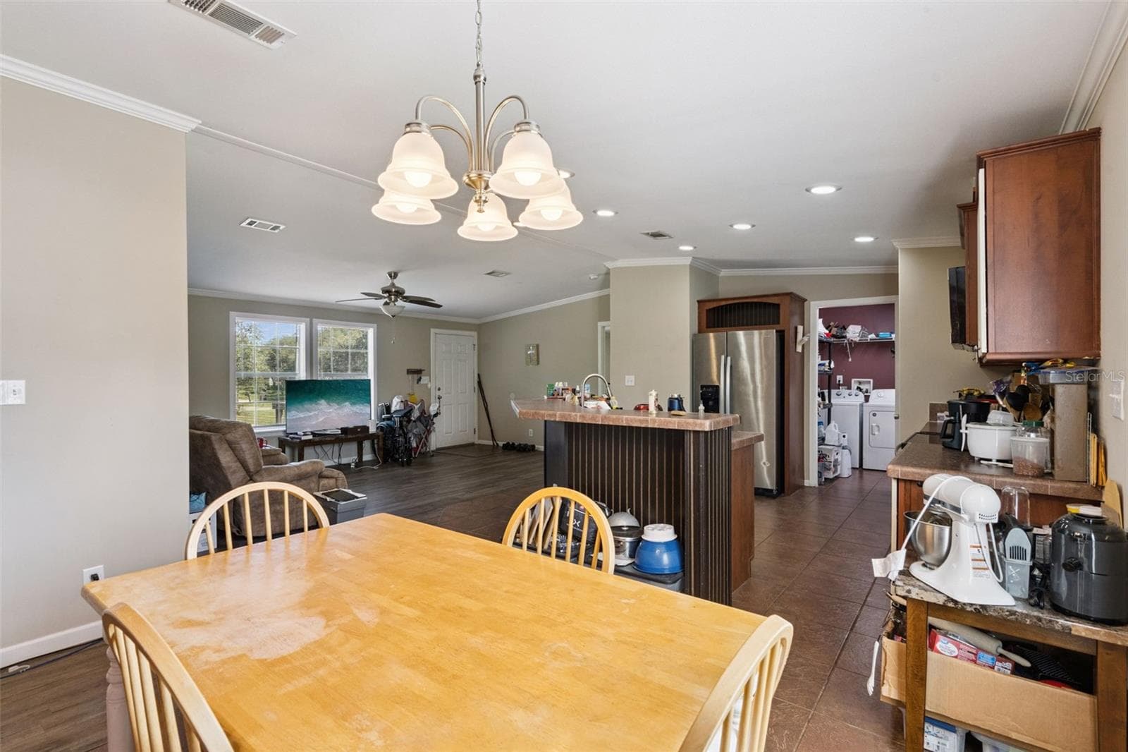 Dining area features crown molding and vaulted ceilings - 2478 BUCK BOARD TRL, LAKE WALES
