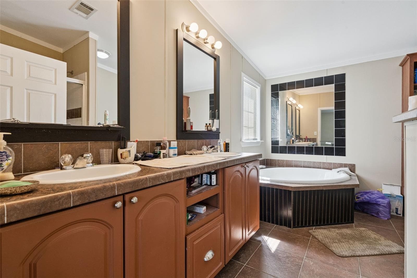 Primary Bath with comfort heigh vanity and dual sinks - 2478 BUCK BOARD TRL, LAKE WALES