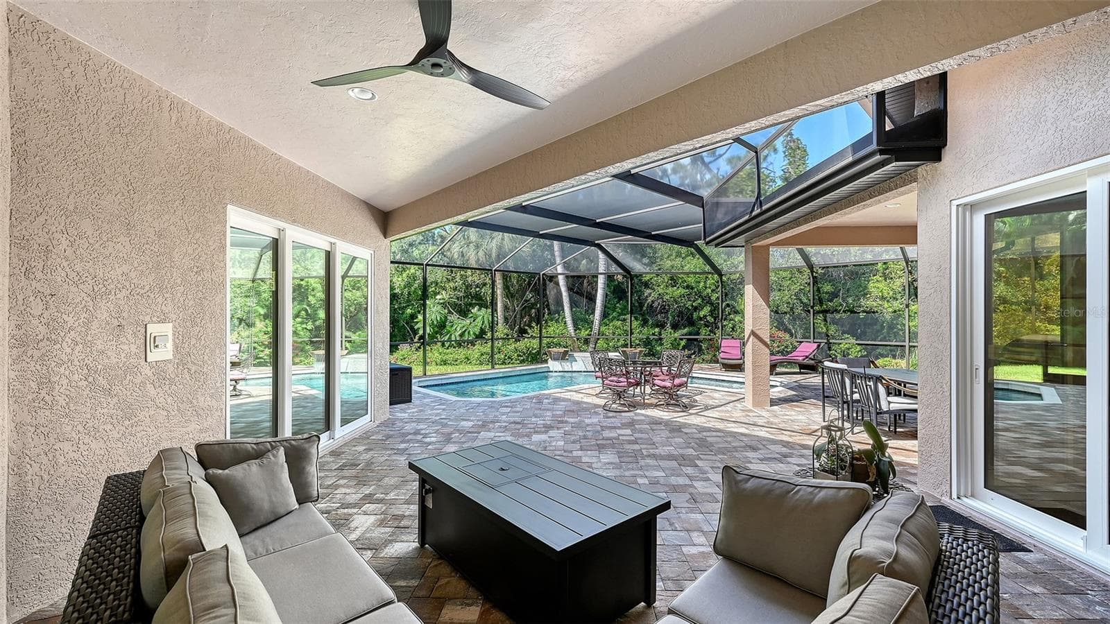 Covered lanai in the pool area. - 8866 BLOOMFIELD BLVD, SARASOTA
