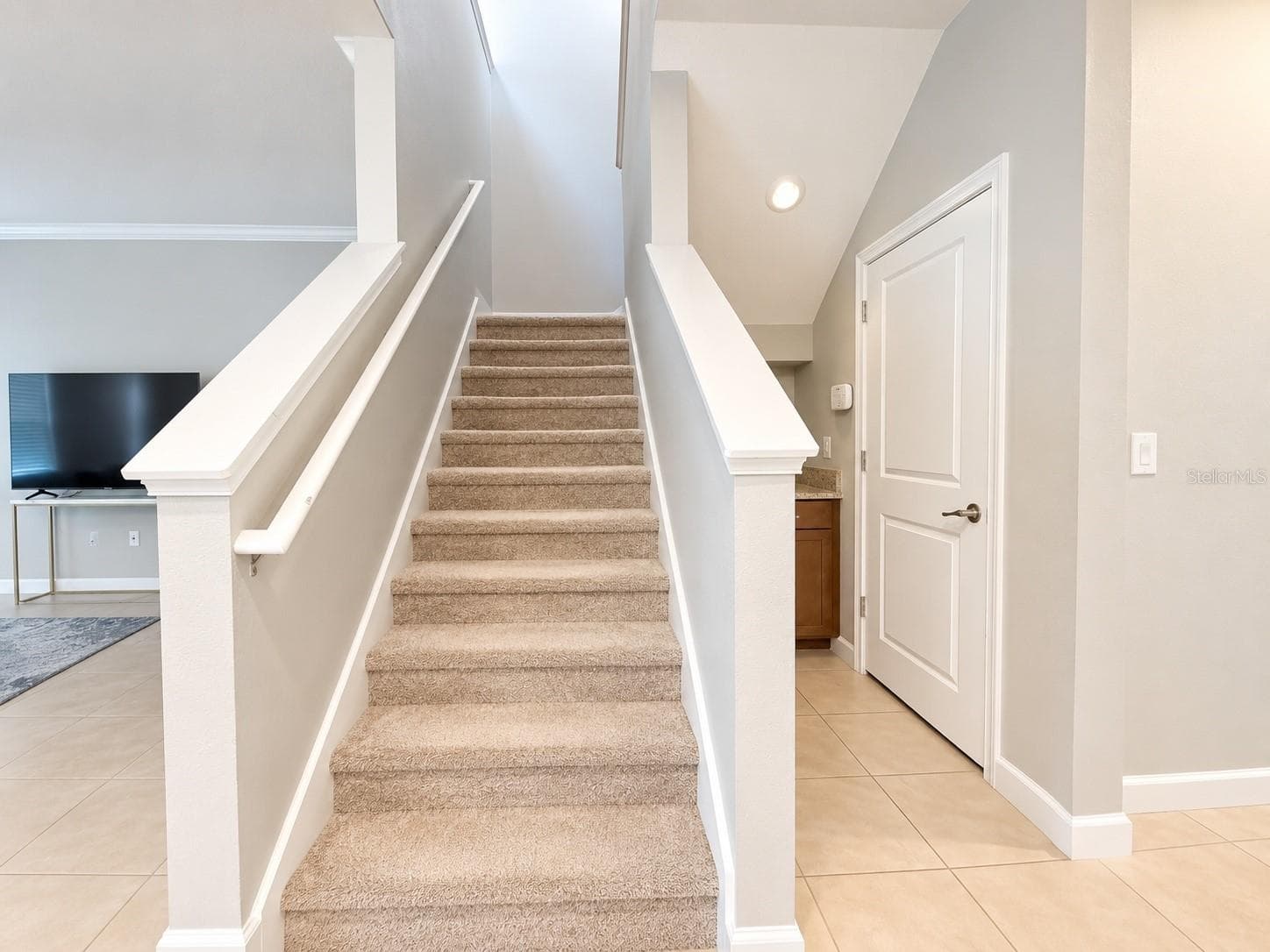 Carpeted stairway - 1516 BUNKER DR, DAVENPORT
