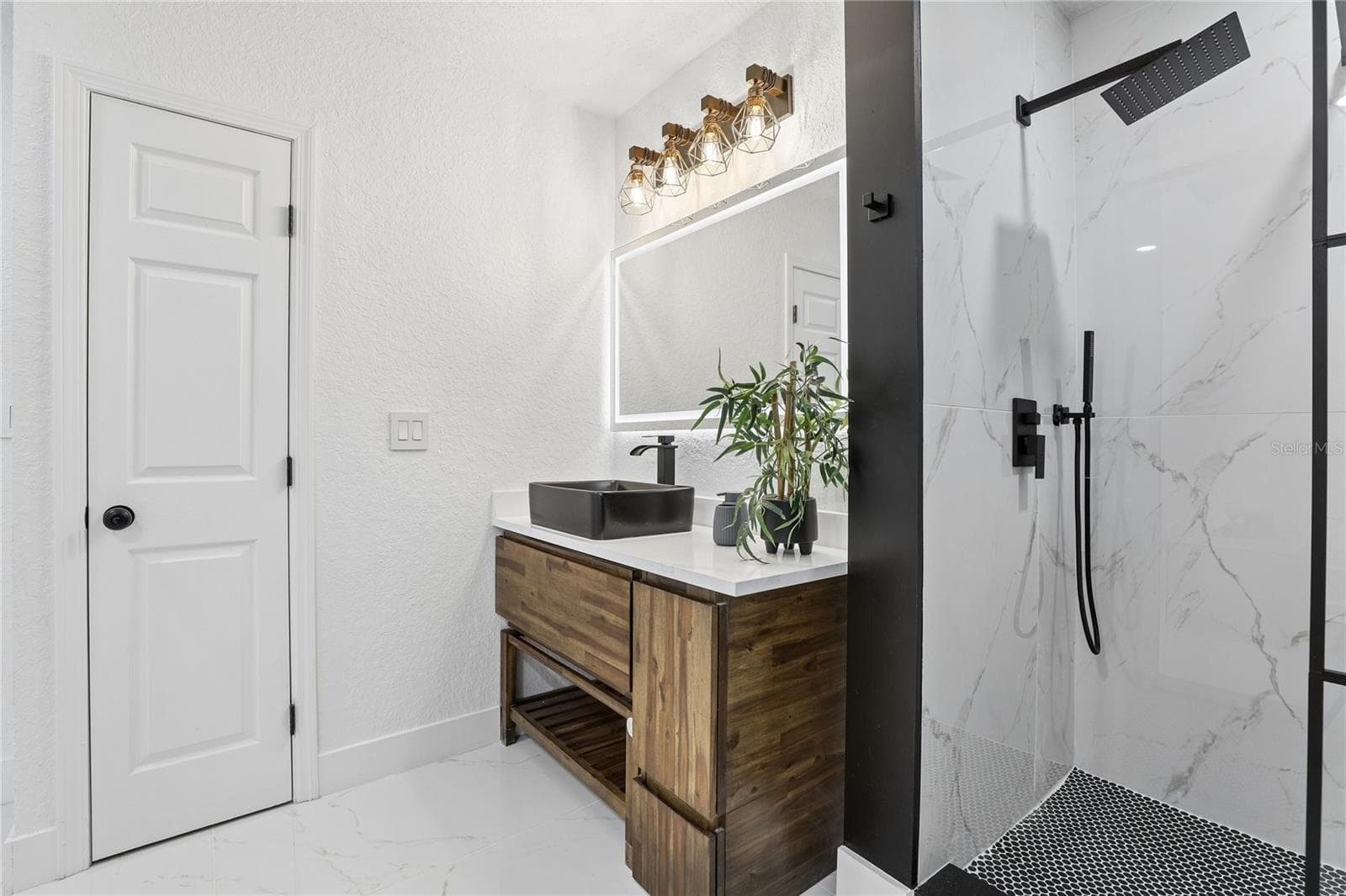 Designer primary bath with vessel sink, illuminated mirror and modern finishes - 1718 CAMPBELL AVE, ORLANDO