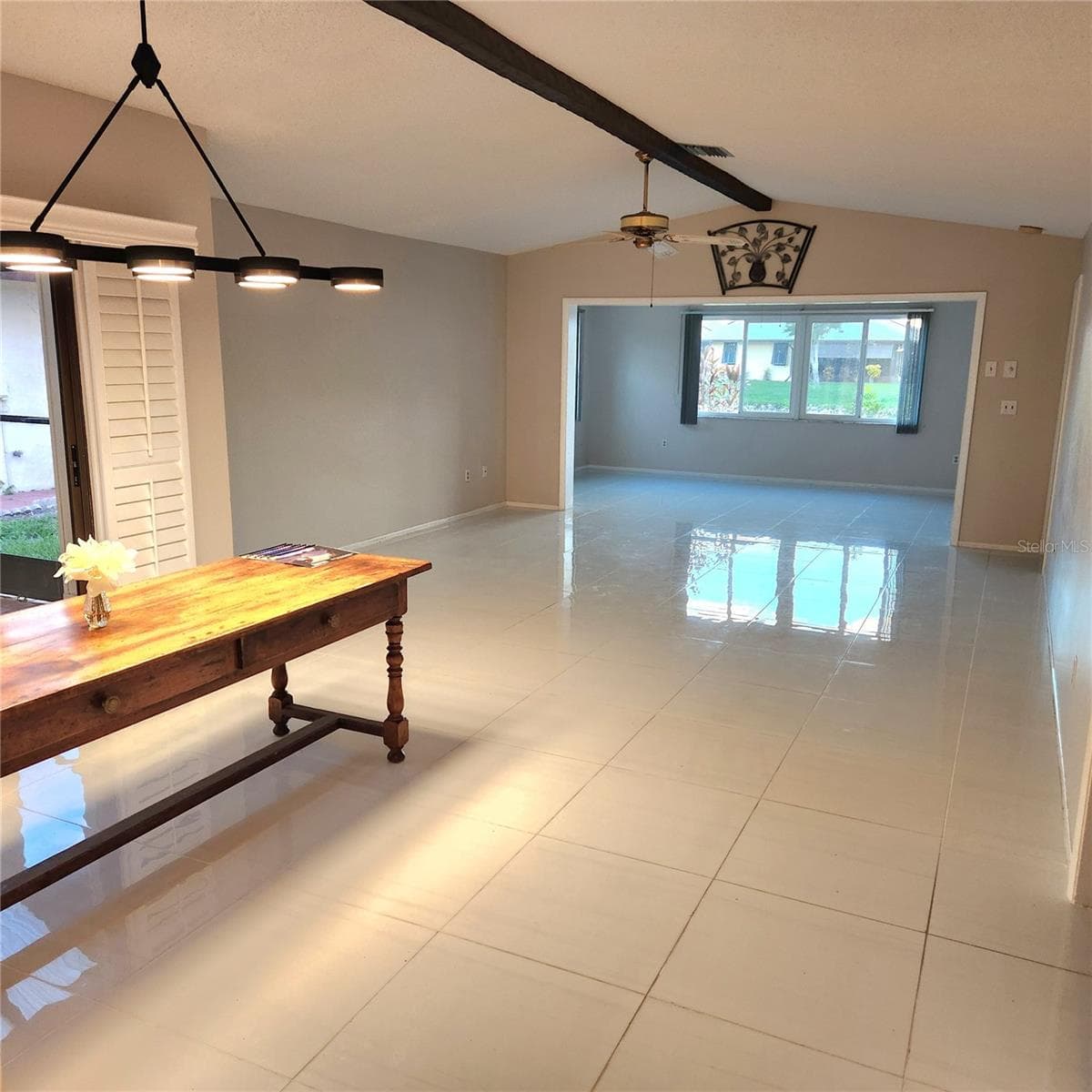view from entry/foyer. Dining room to left with beautiful light over table. - 49 SANDSTONE CIR, VENICE