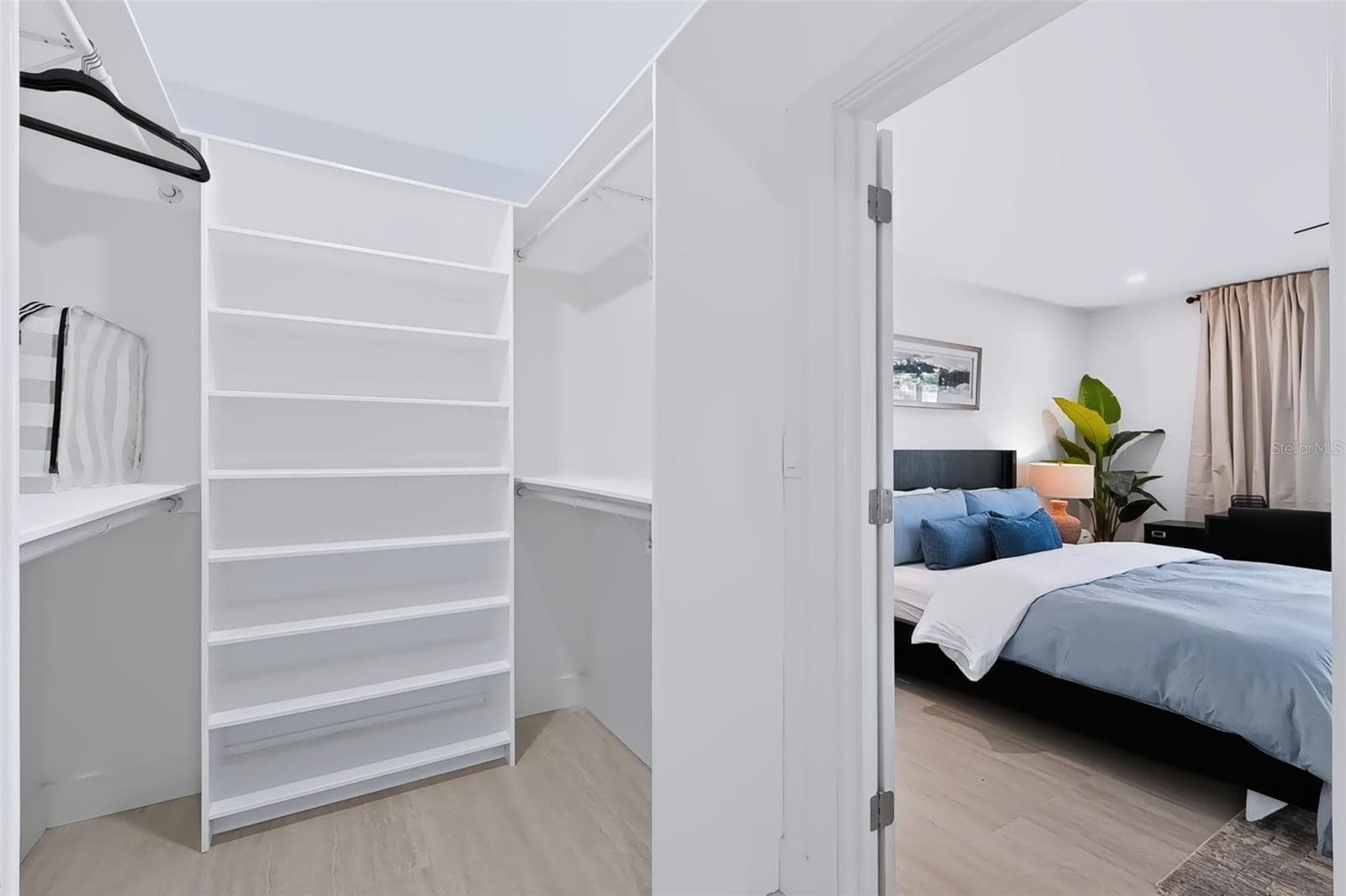 1 of 2 walk in closets - primary bedroom - 5962 LEELAND ST S, ST PETERSBURG