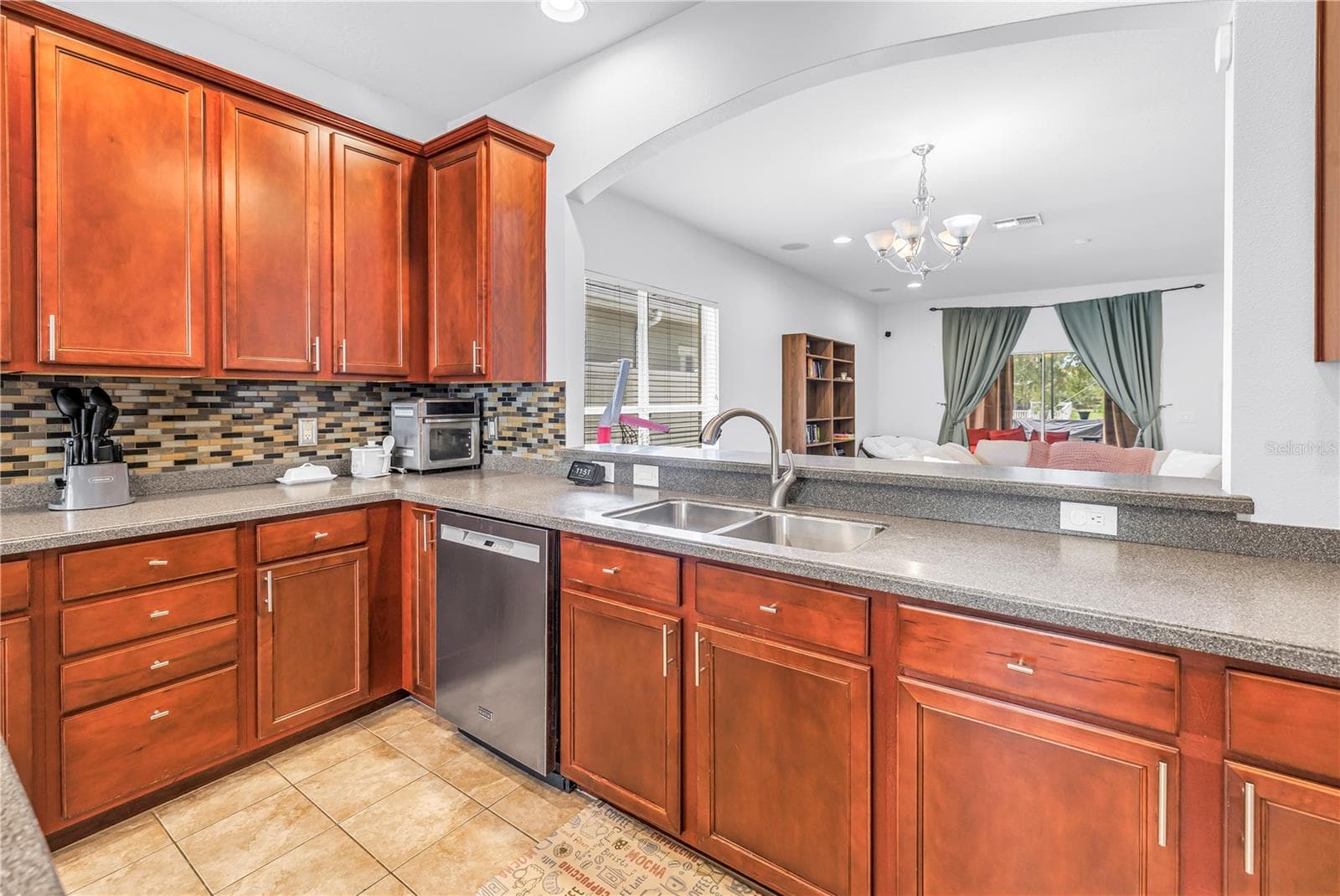 Kitchen With Island and View Into Living Area - 7717 TANGLE BROOK BLVD, GIBSONTON