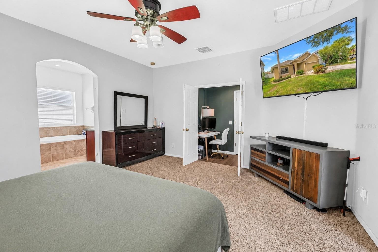Primary Bedroom With View Into Primary Bathroom - 7717 TANGLE BROOK BLVD, GIBSONTON