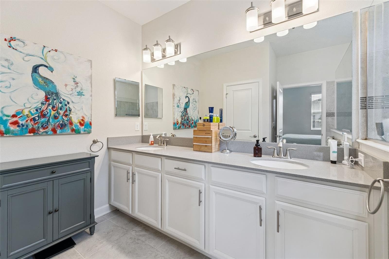 Primary Bathroom offers Comfort-Height Vanity with Dual Sinks, Quartz Counter Tops and A Water Closet - 4075 BEDFORD AVE, WINTER HAVEN