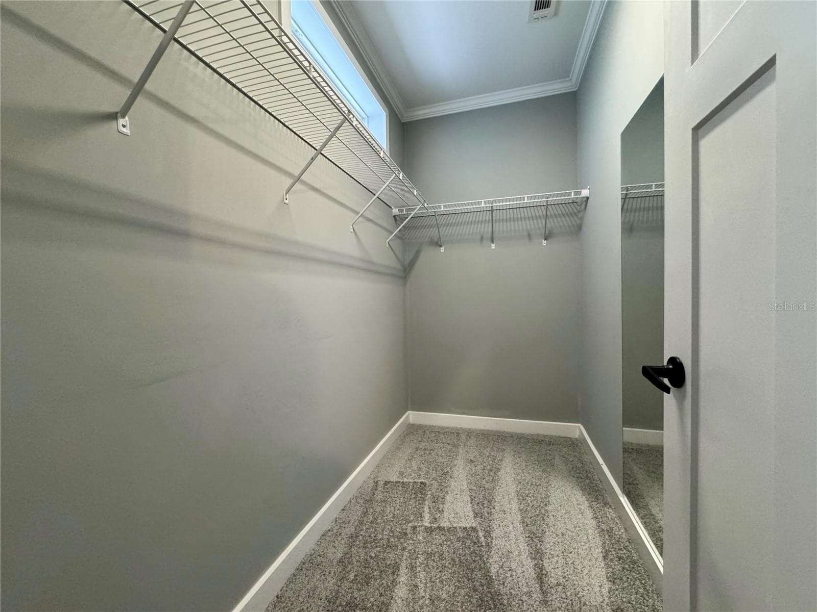 Primary bedroom walk-in closet. - 9248 SCEPTER AVE, BROOKSVILLE