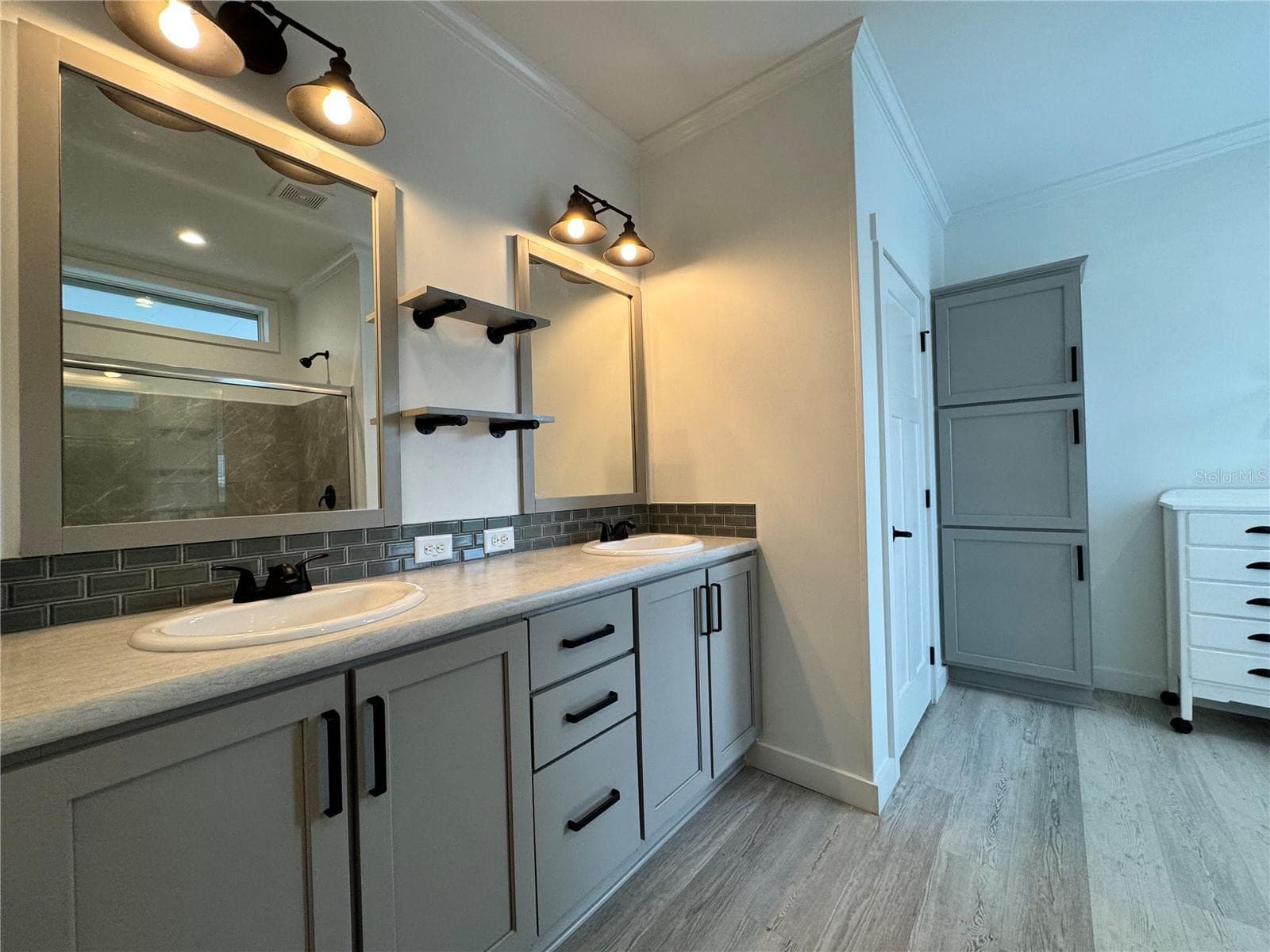Primary bathroom with dual sinks. - 9248 SCEPTER AVE, BROOKSVILLE