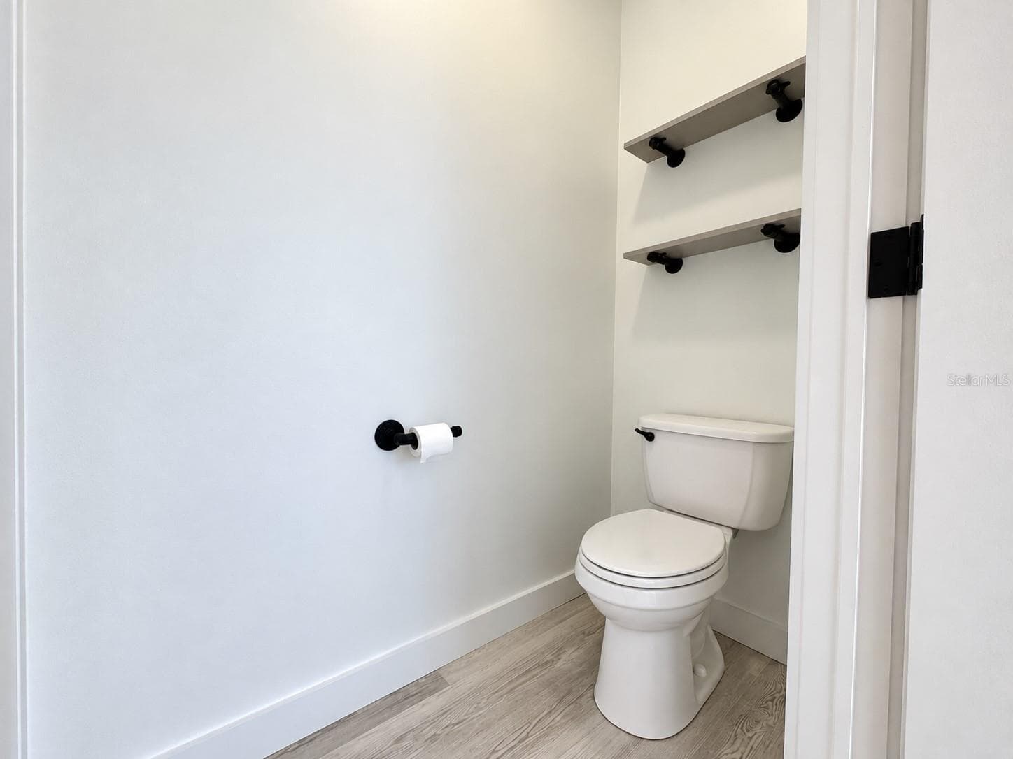 Water closet in primary bathroom. - 9248 SCEPTER AVE, BROOKSVILLE