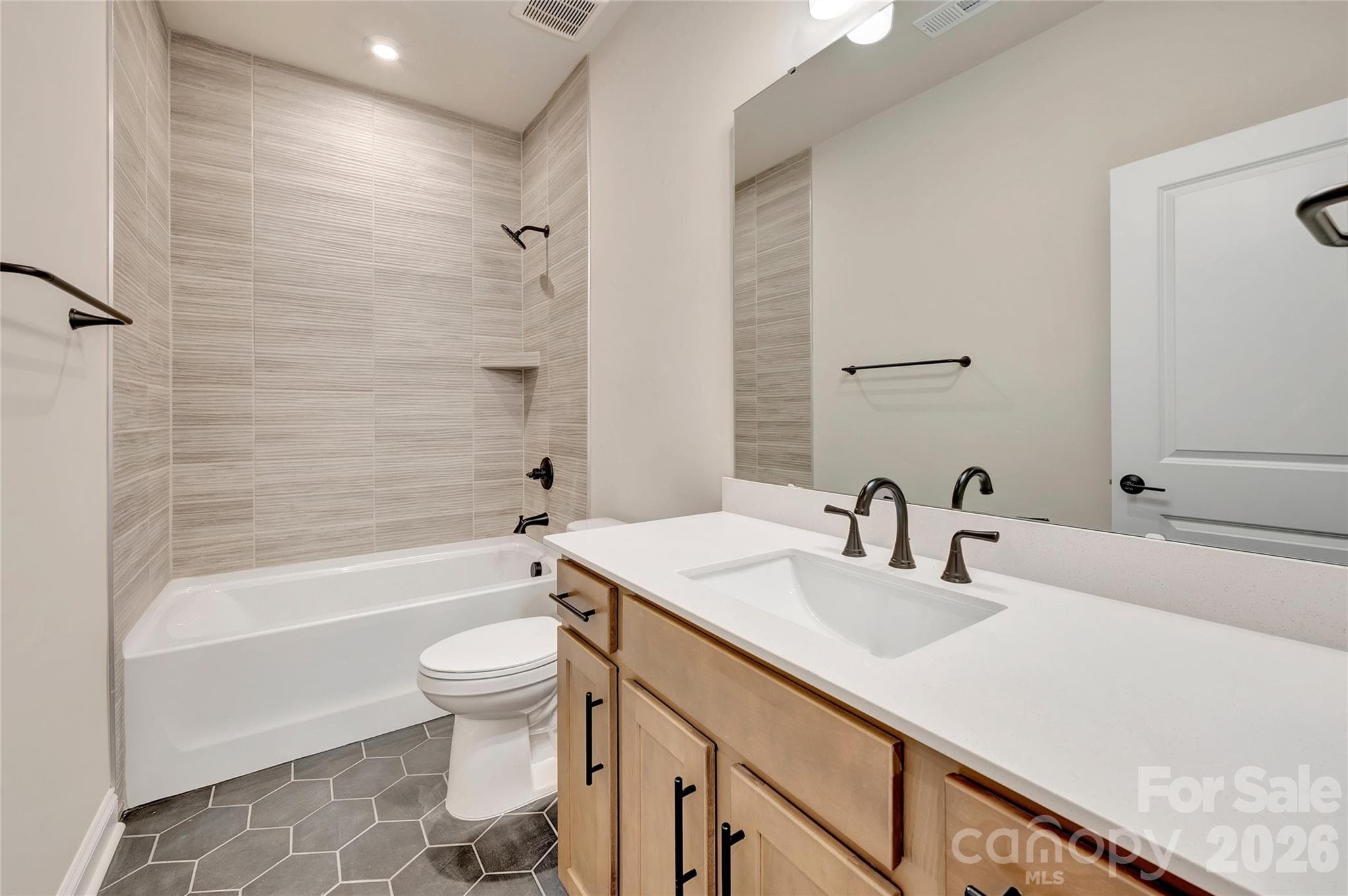 Secondary bathroom with tiled walls above the tub - 444 Old Town Village Road, Waxhaw