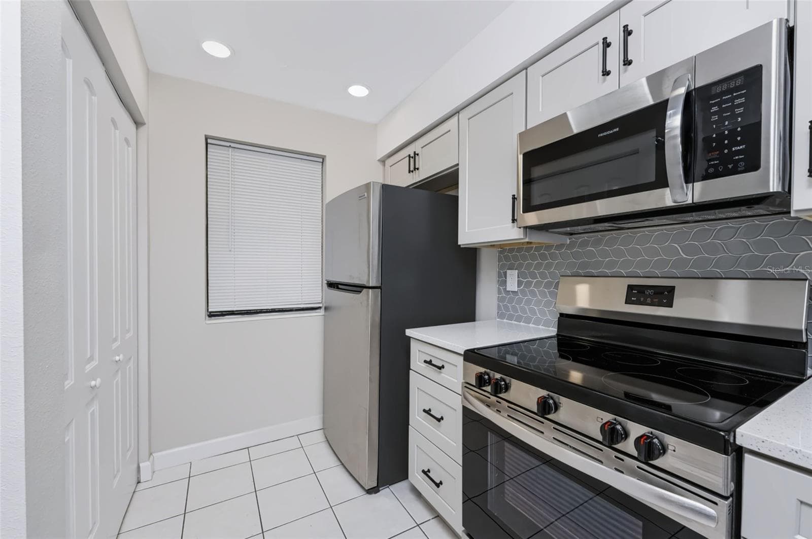 All stainless steel appliances & recessed lighting. - 1751 BEACH RD #202, ENGLEWOOD