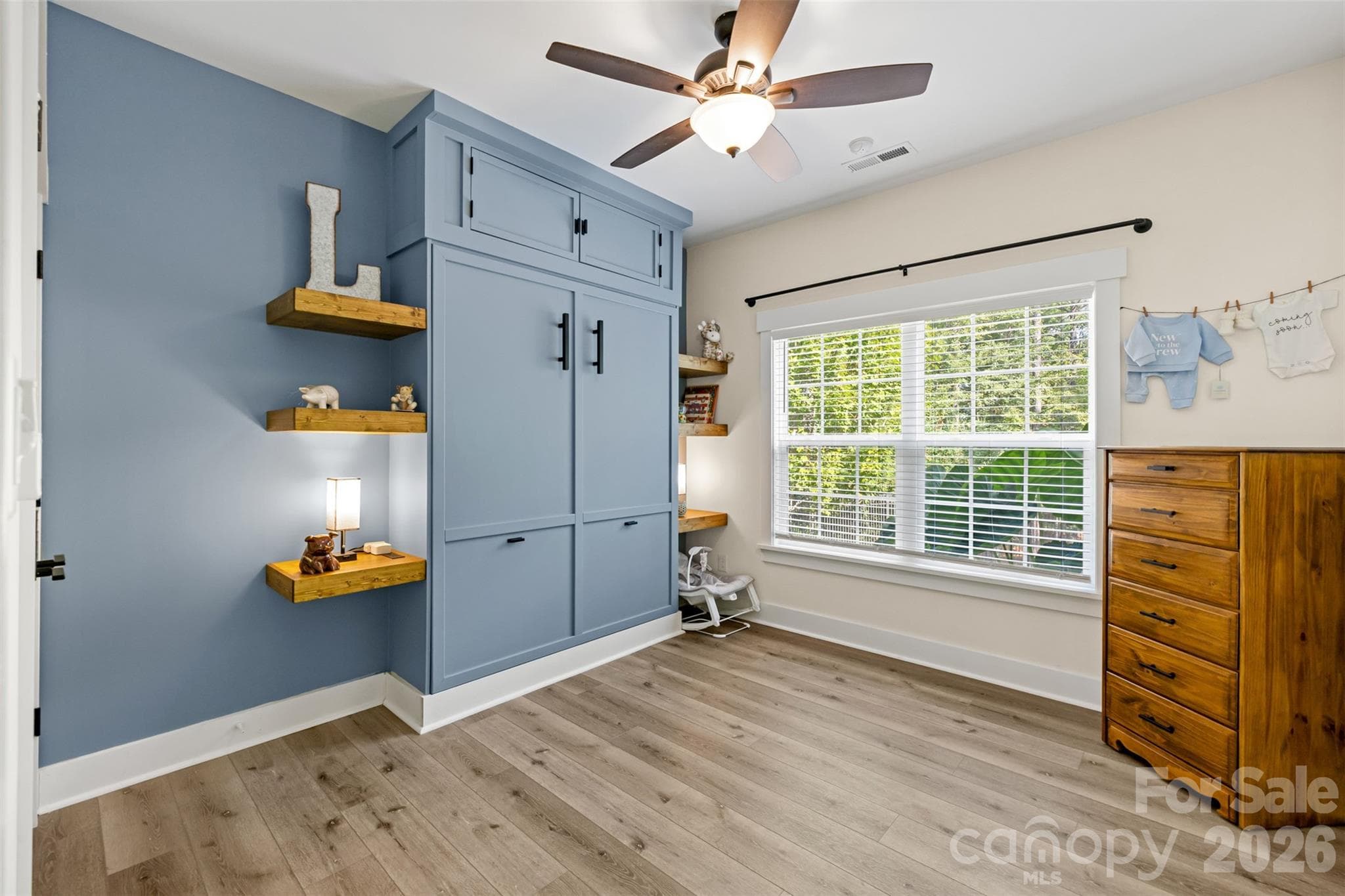 Flexible bedroom featuring a clever built-in Murphy bed - 1604 Aragon Beach Road, Rock Hill
