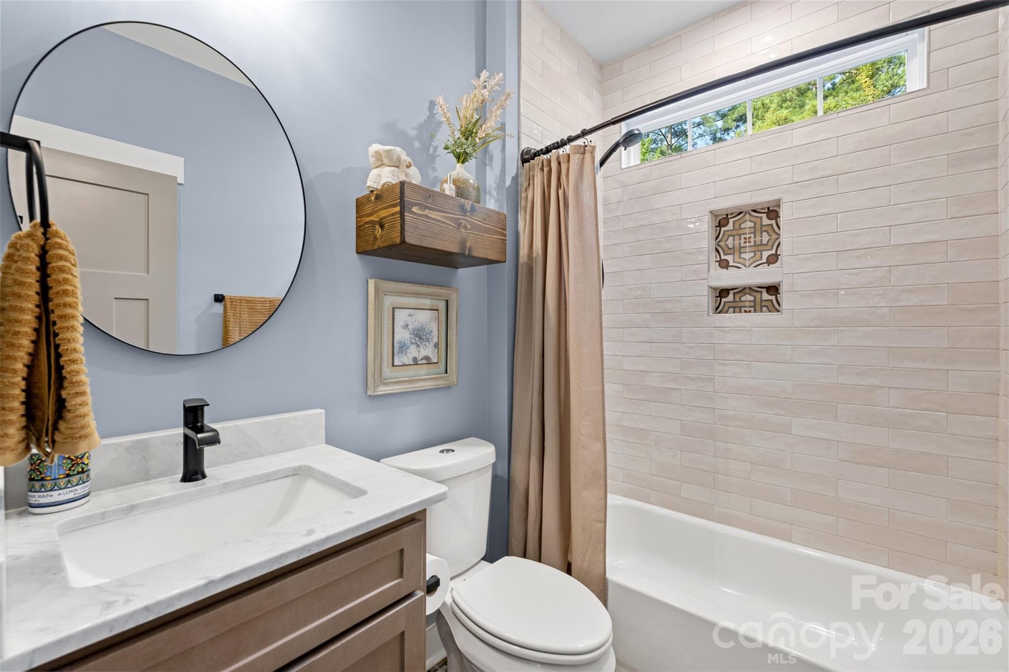 Stylish secondary bath with floor-to-ceiling shower tile - 1604 Aragon Beach Road, Rock Hill
