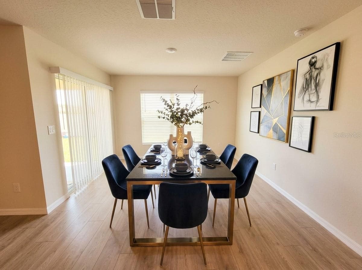 DINING ROOM AI STAGED - 11904 MOUNTAIN ISLAND TRL, PARRISH