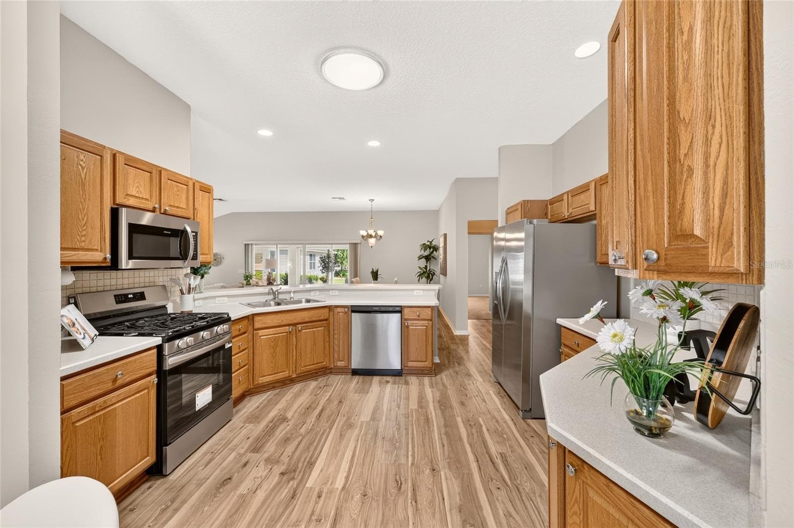 Spacious kitchen with an abundance of cabinets and Countertop space. - 17101 SE 94TH BERRIEN CT, THE VILLAGES