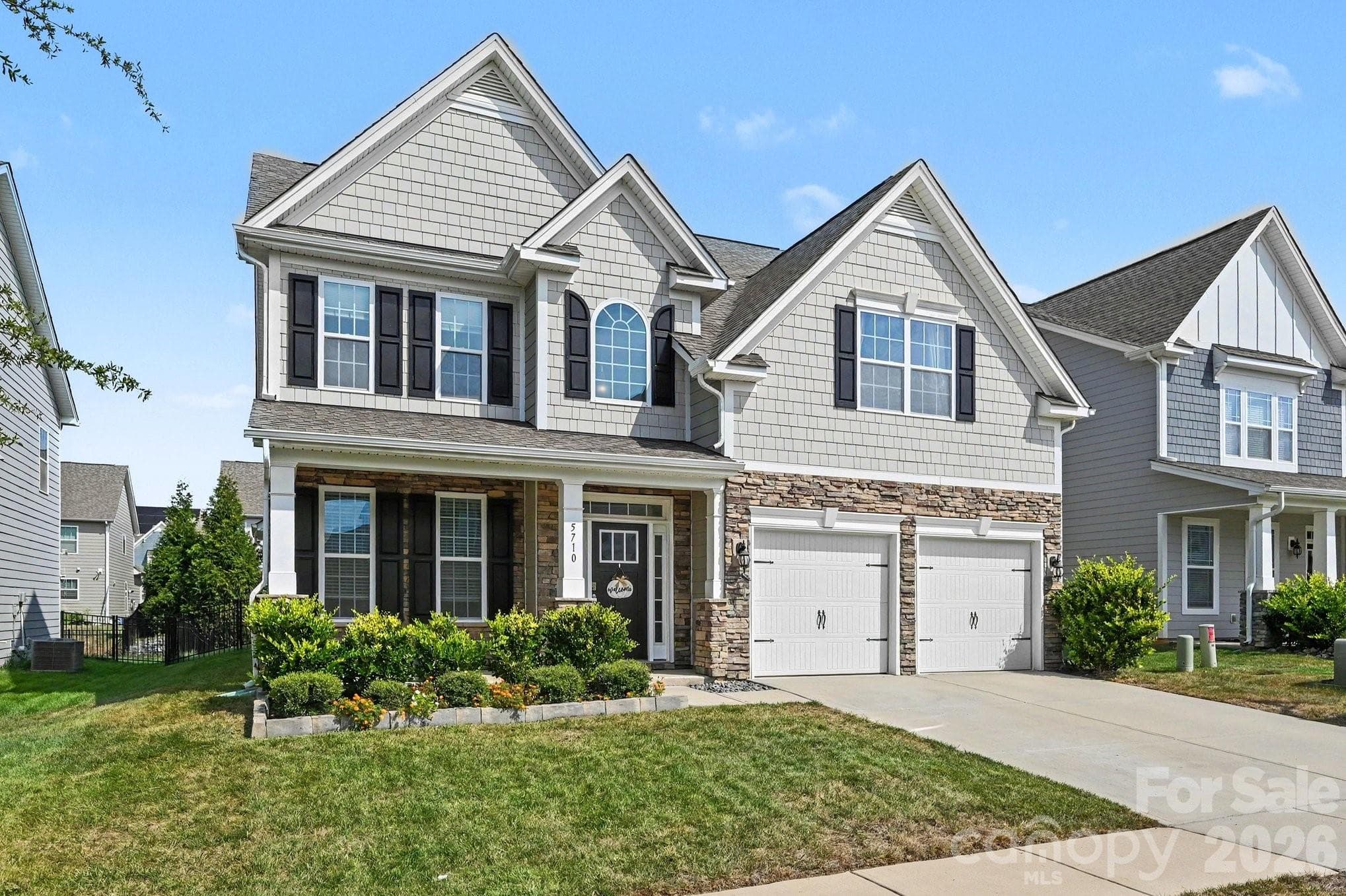Beautifully maintained two-story home with two car garage and covered porch - 5710 Rainbow Lane, Indian Land