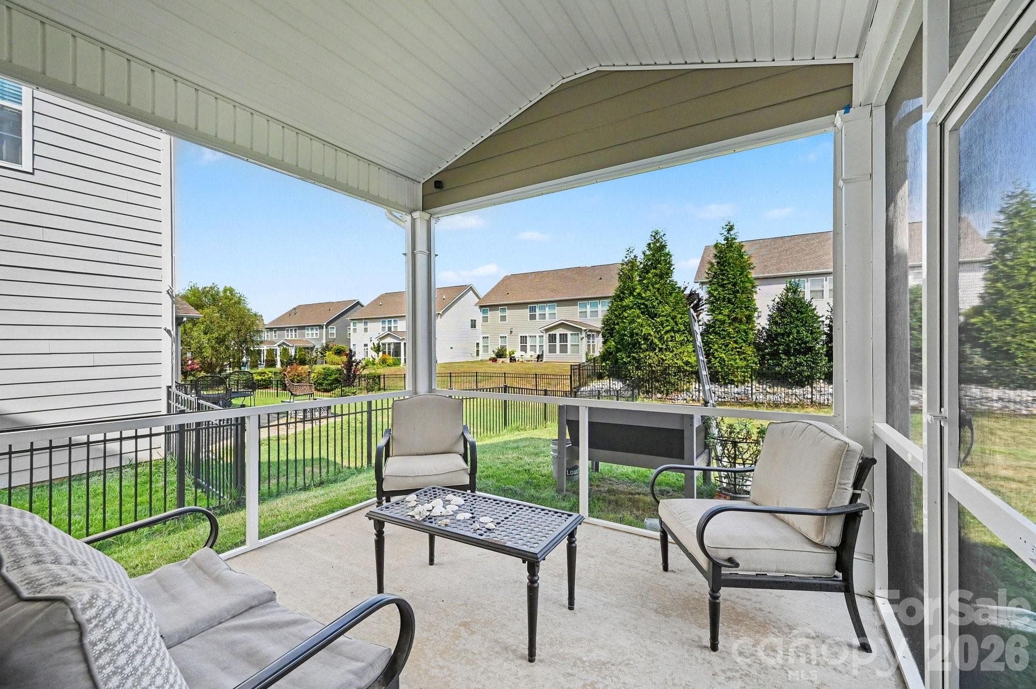 Screened-in patio offers comfortable relaxation - 5710 Rainbow Lane, Indian Land