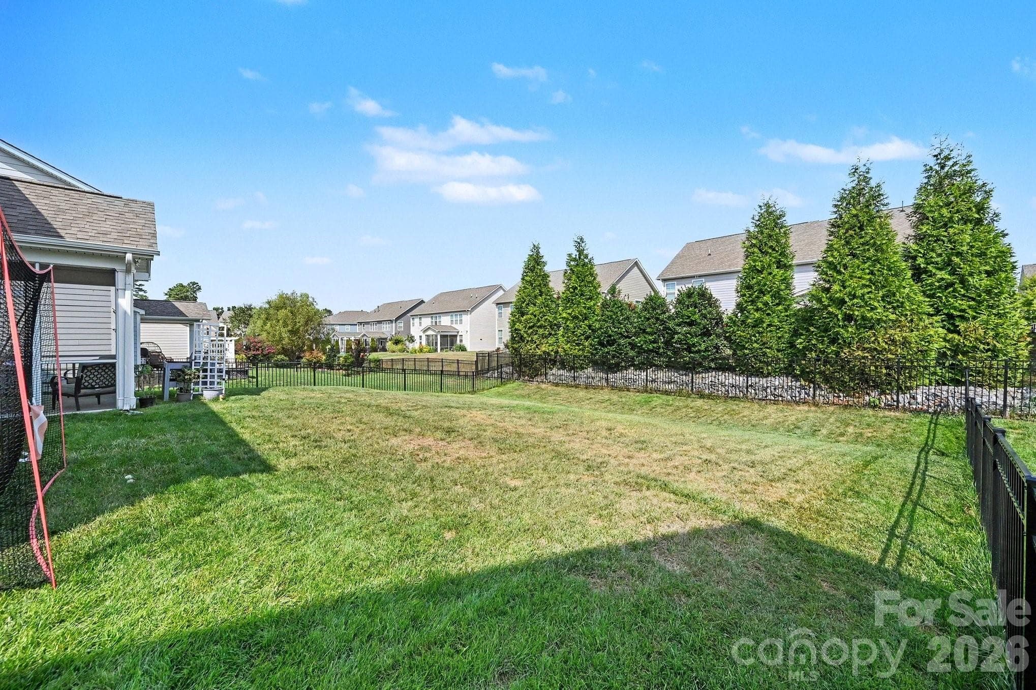 Fully fenced backyard with plenty of space for gardening, play, pets, and outdoor enjoyment - 5710 Rainbow Lane, Indian Land