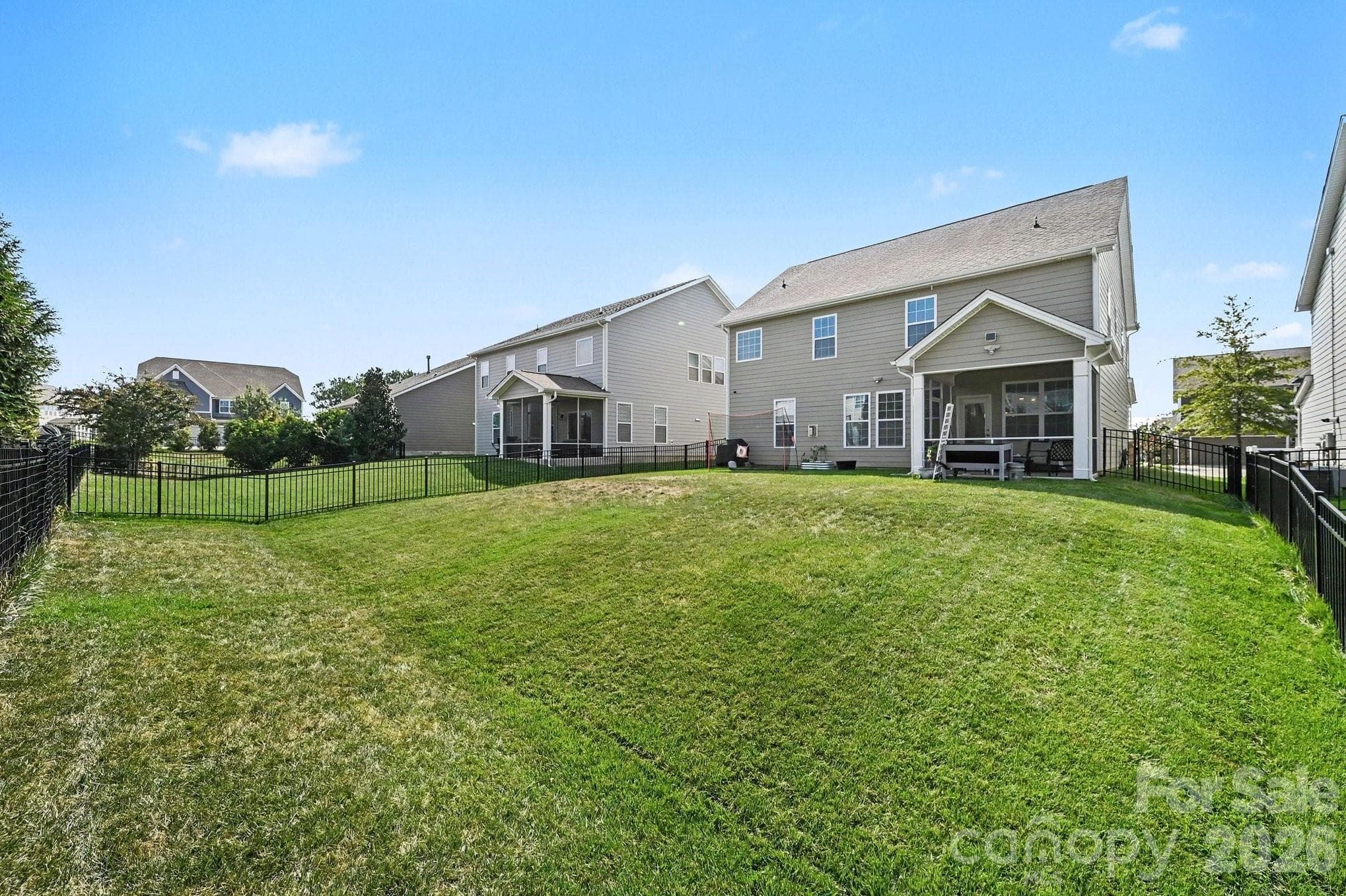 Fully fenced backyard with plenty of space for gardening, play, pets, and outdoor enjoyment - 5710 Rainbow Lane, Indian Land