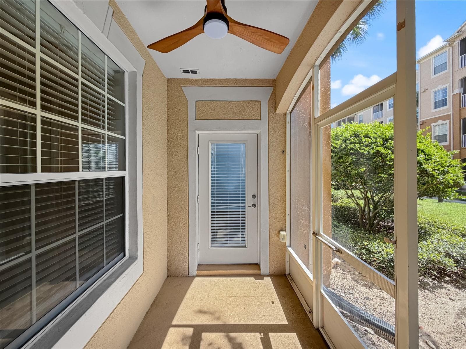 Back porch with views of grounds. - 6434 CAVA ALTA DR #105, ORLANDO