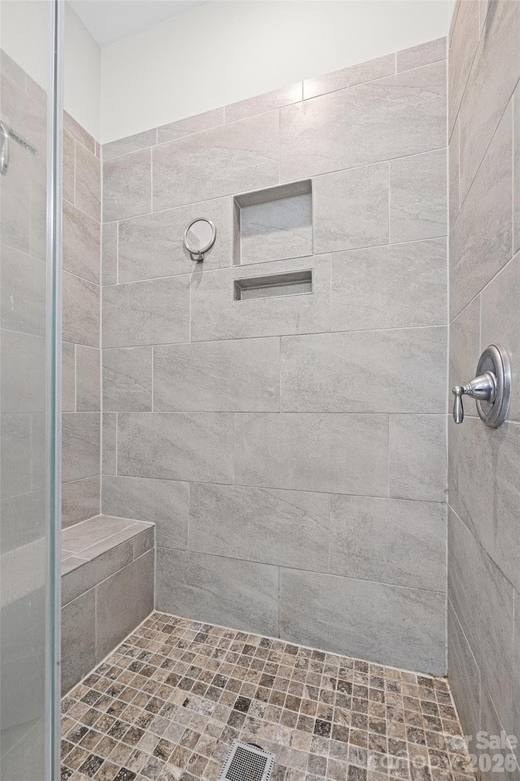 Walk-in shower with stylish tile. - 14830 Batteliere Drive, Charlotte